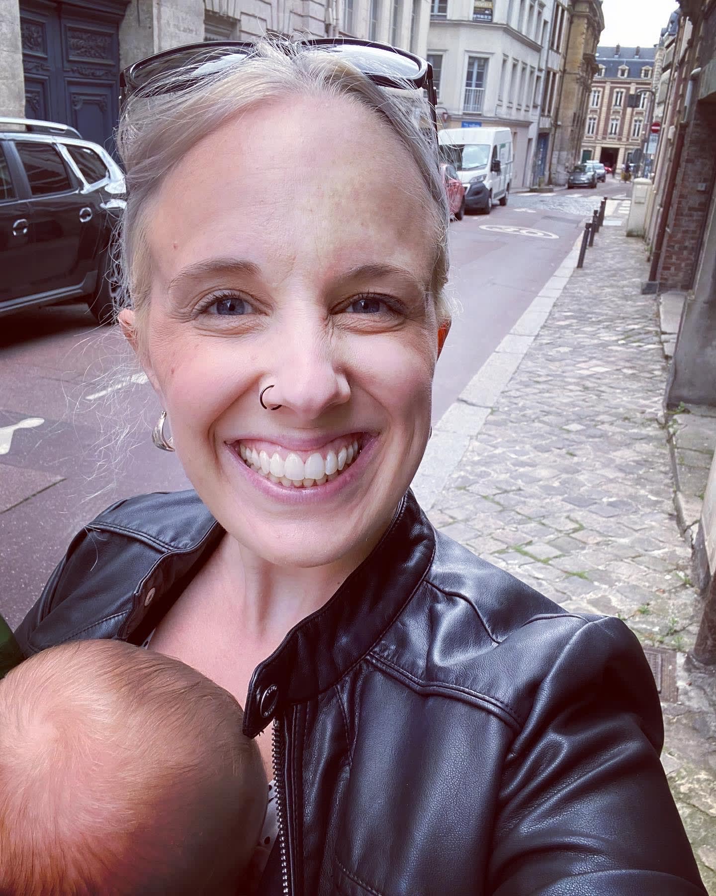 Picture of Leah with baby in a street