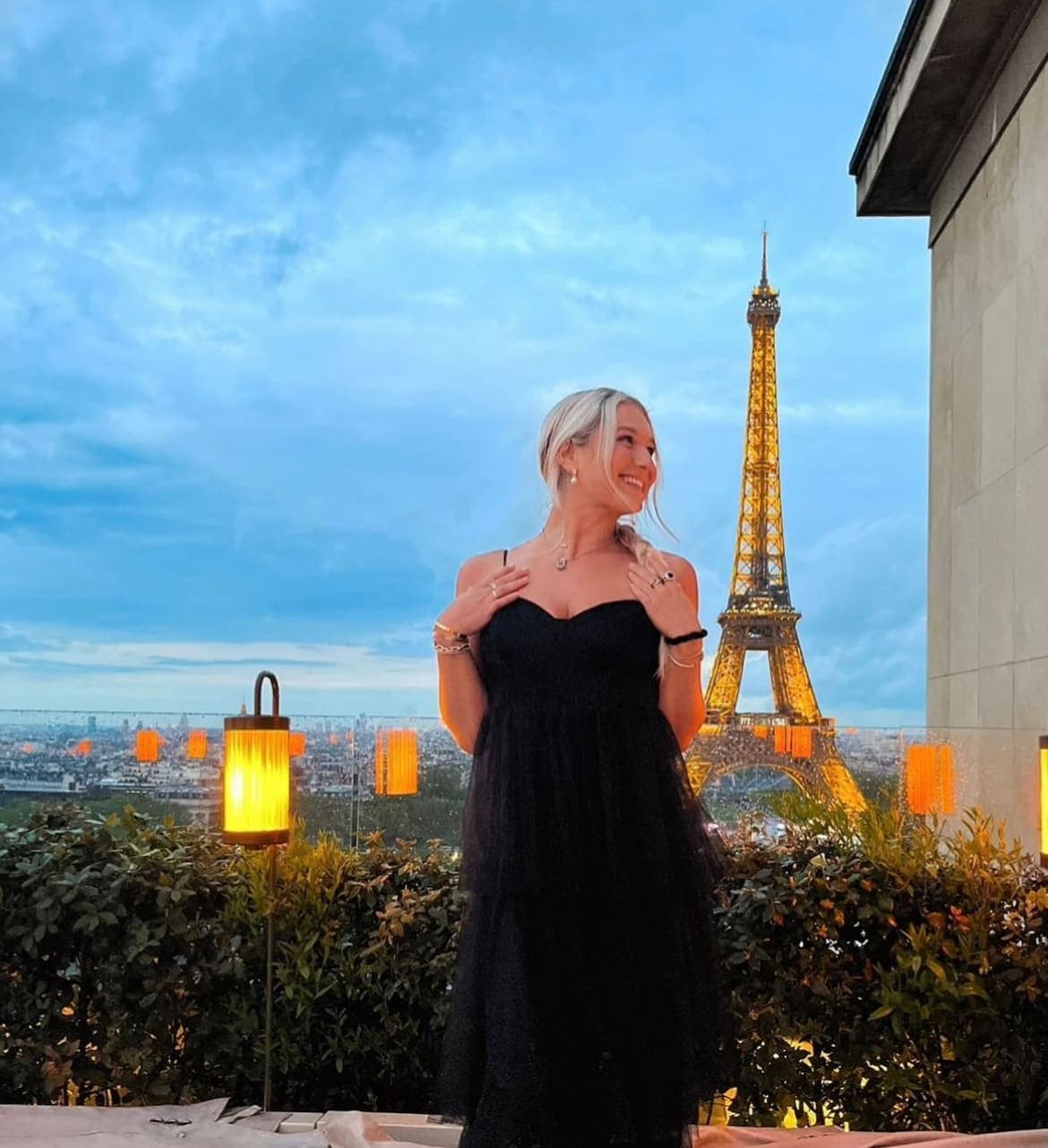 Picture of Maragn in black dress with Eiffle tower in view