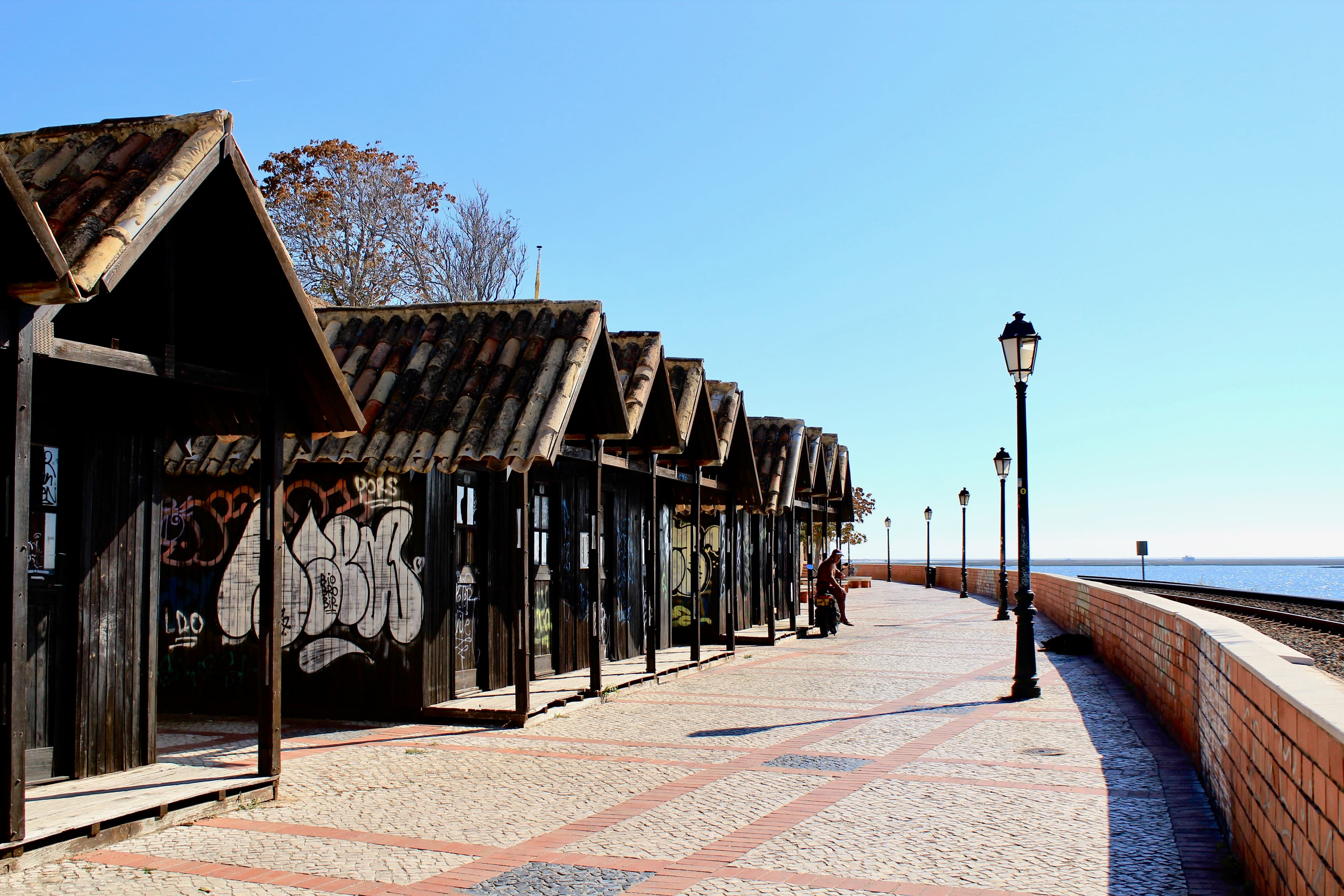 Coastal Railway line on a sunny day outside the old city at Faro Algarve in Portugal