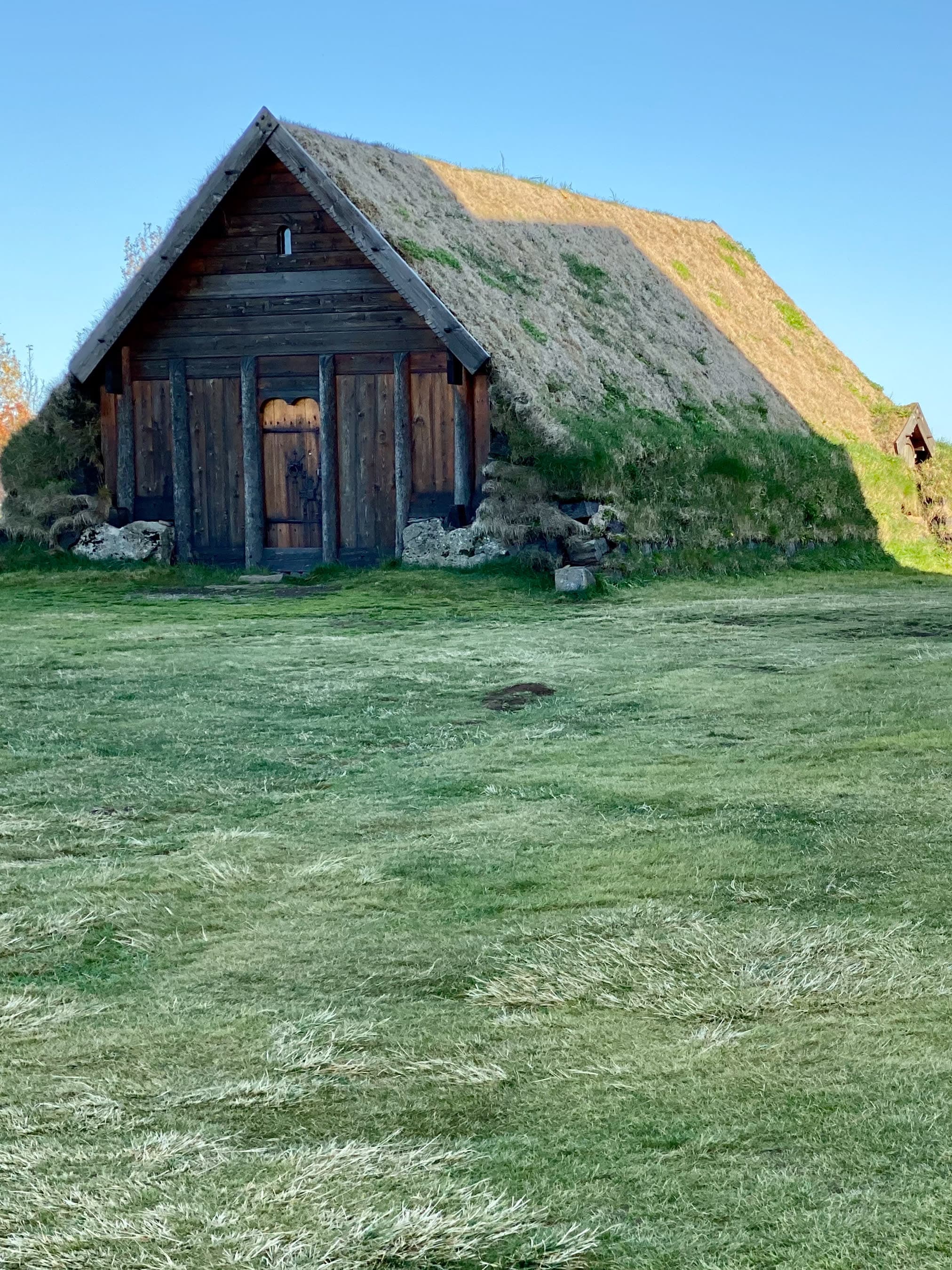 View of a cottage with the roof completely covered in grass