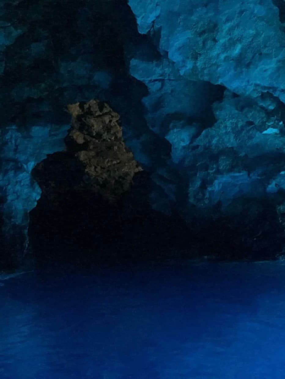 Beautiful view of a deep blue underwater cave with rock formations