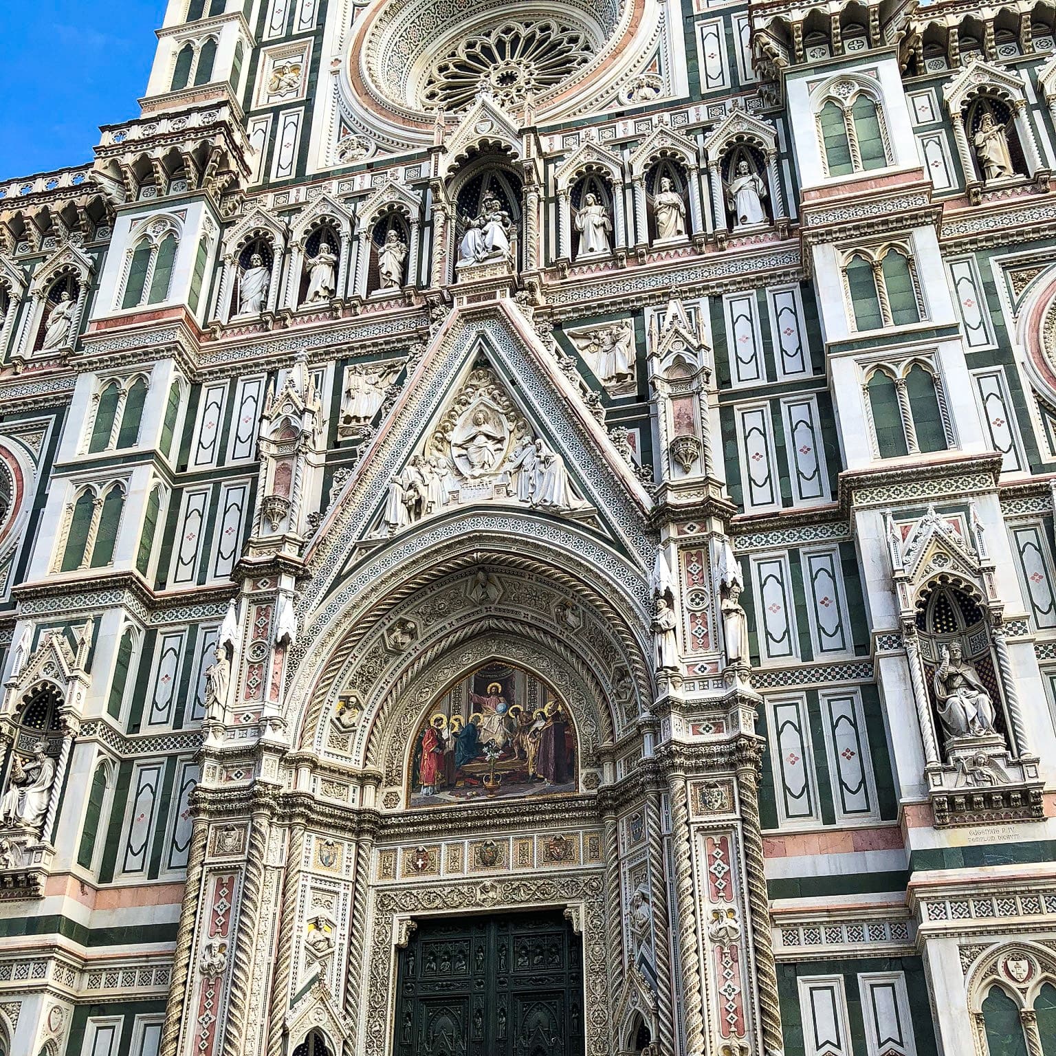 The outside of an ornate Italian church.