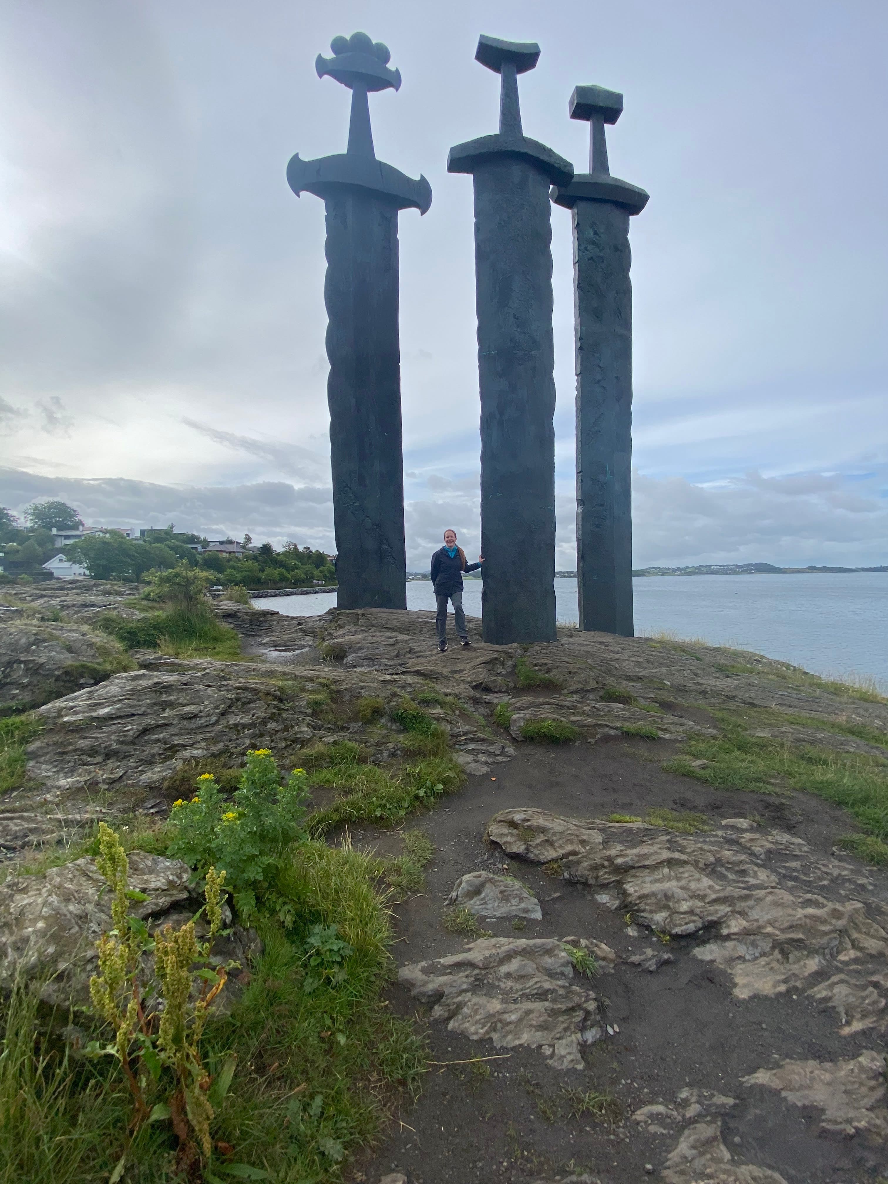 An image of an outdoor structure during the daytime with the ocean in the distance.