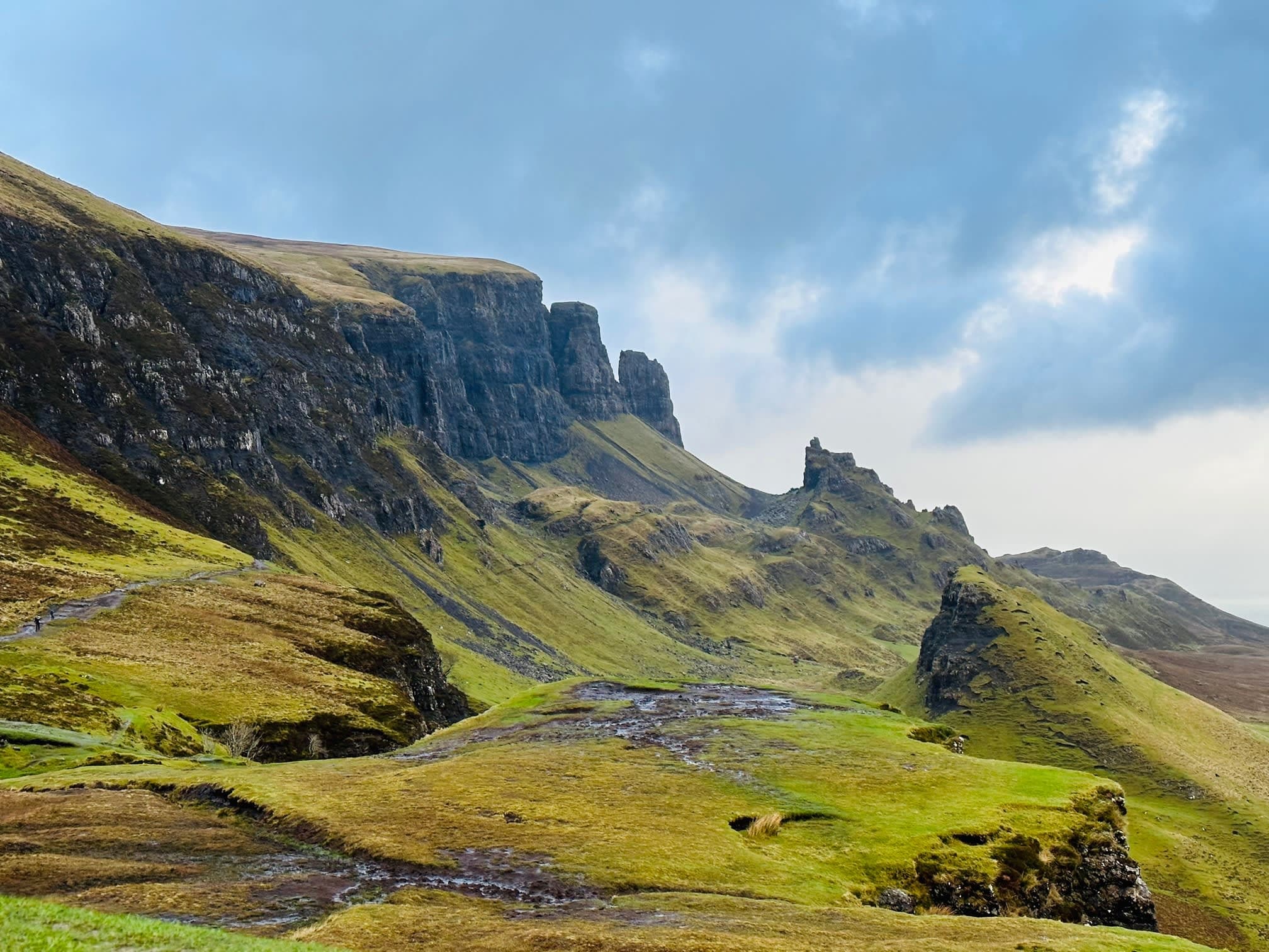 Image of green cliffs during the day.