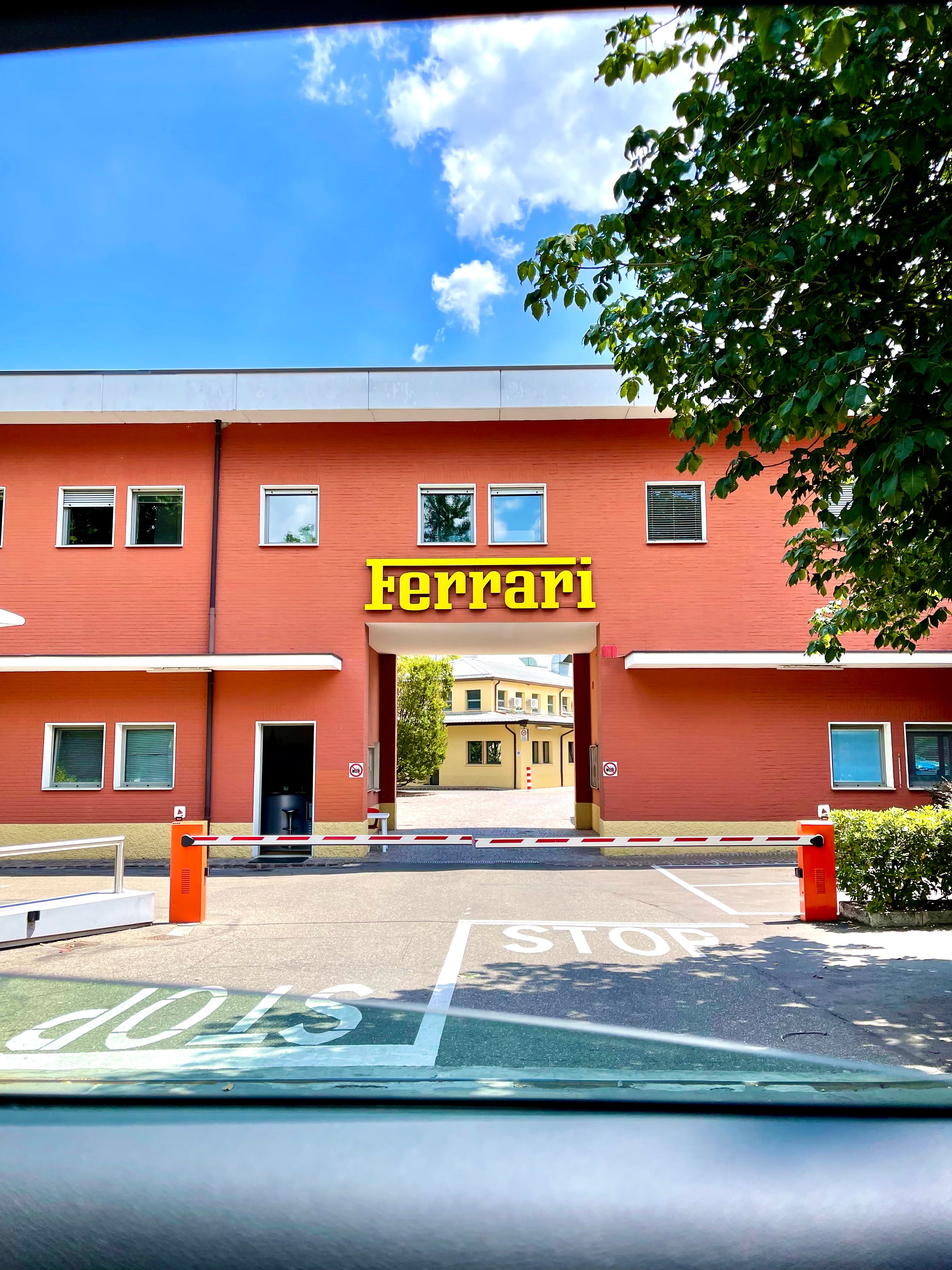 An image of a Ferrari dealership during the day.