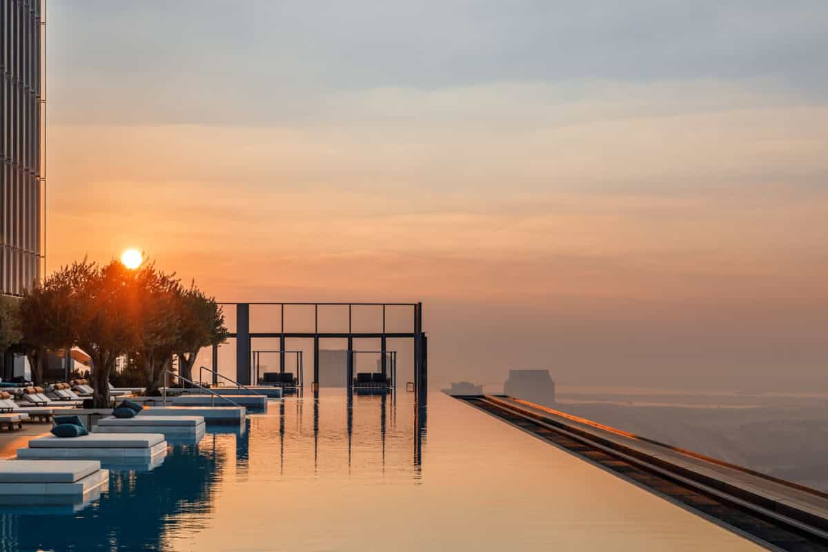 10 Instagram-Worthy Hotel Pools to Visit in 2026 an infinity pool at the top of a building overlooking a city