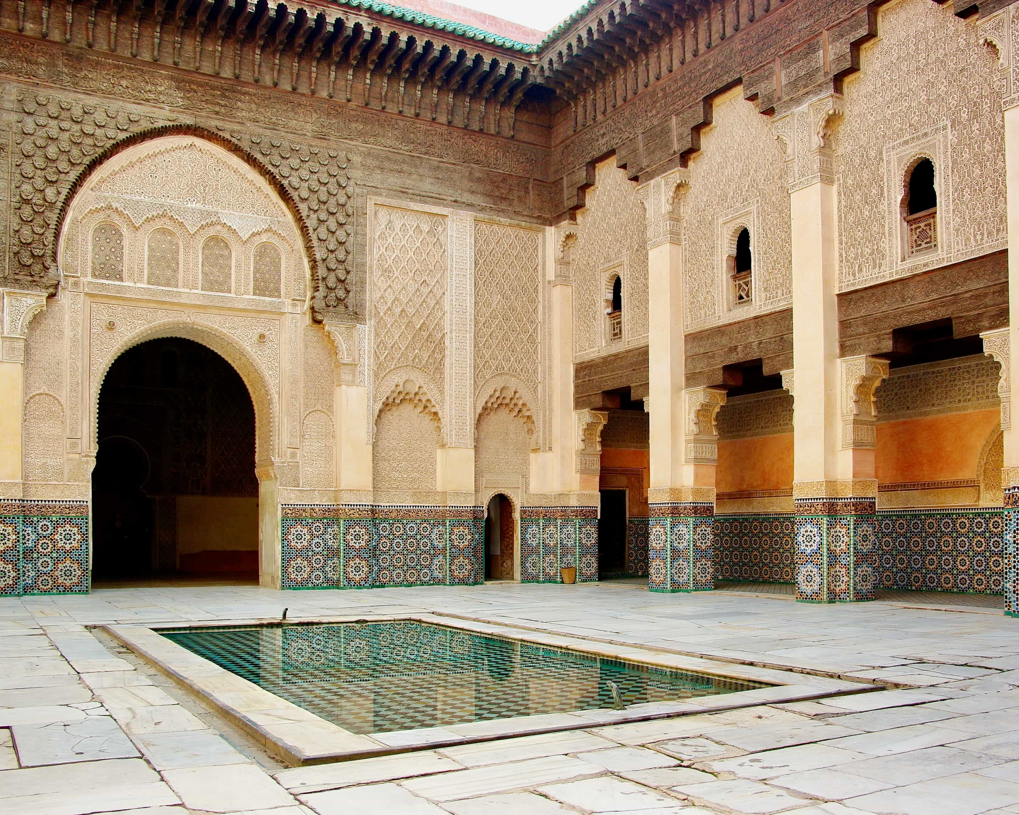 interior courtyard with reflecting pool and ornate turquoise, cream and brown tile walls