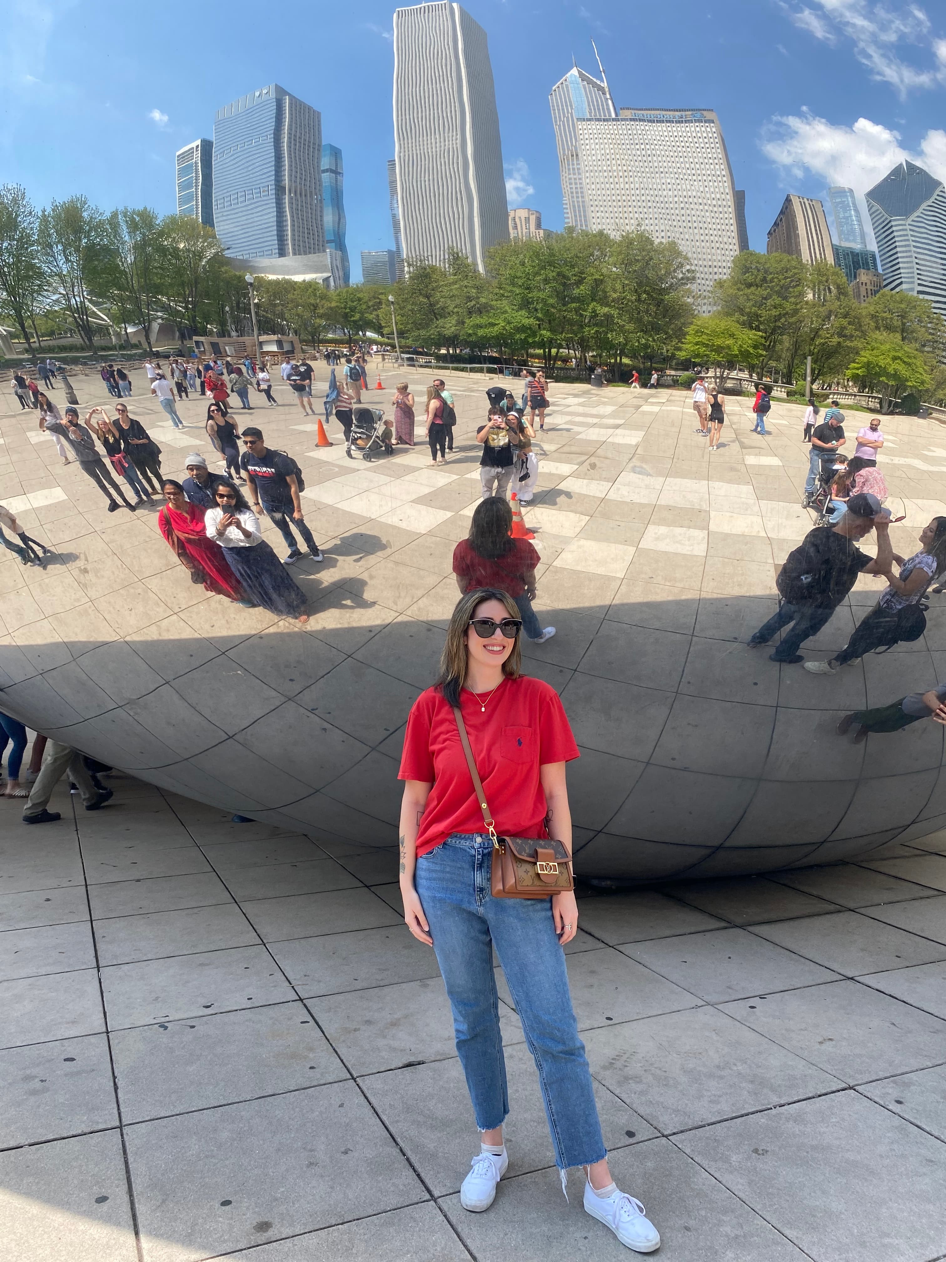 Advisor posing for an image outside the Bean in Chicago.