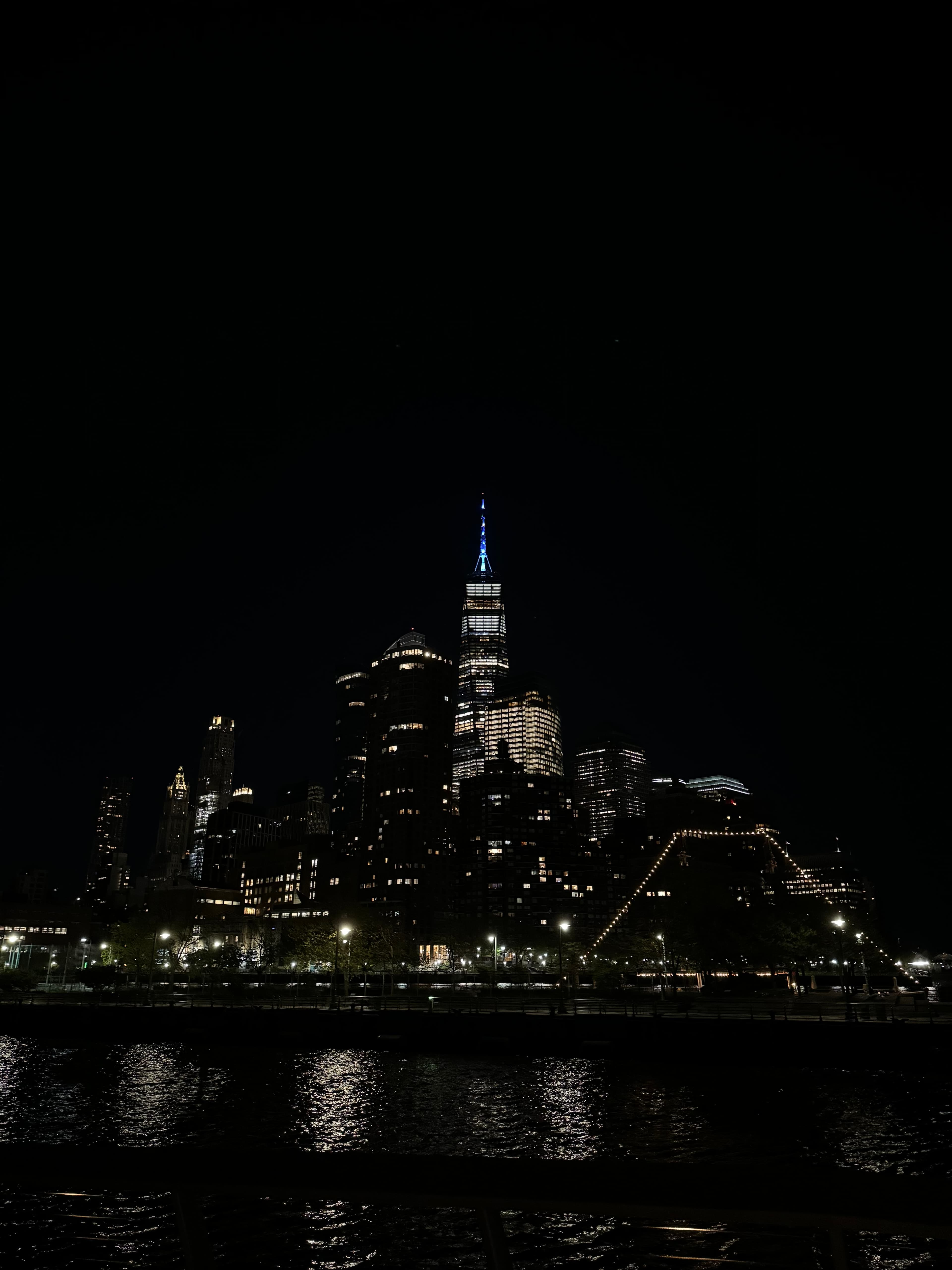 An image at night of a city with bright lights.