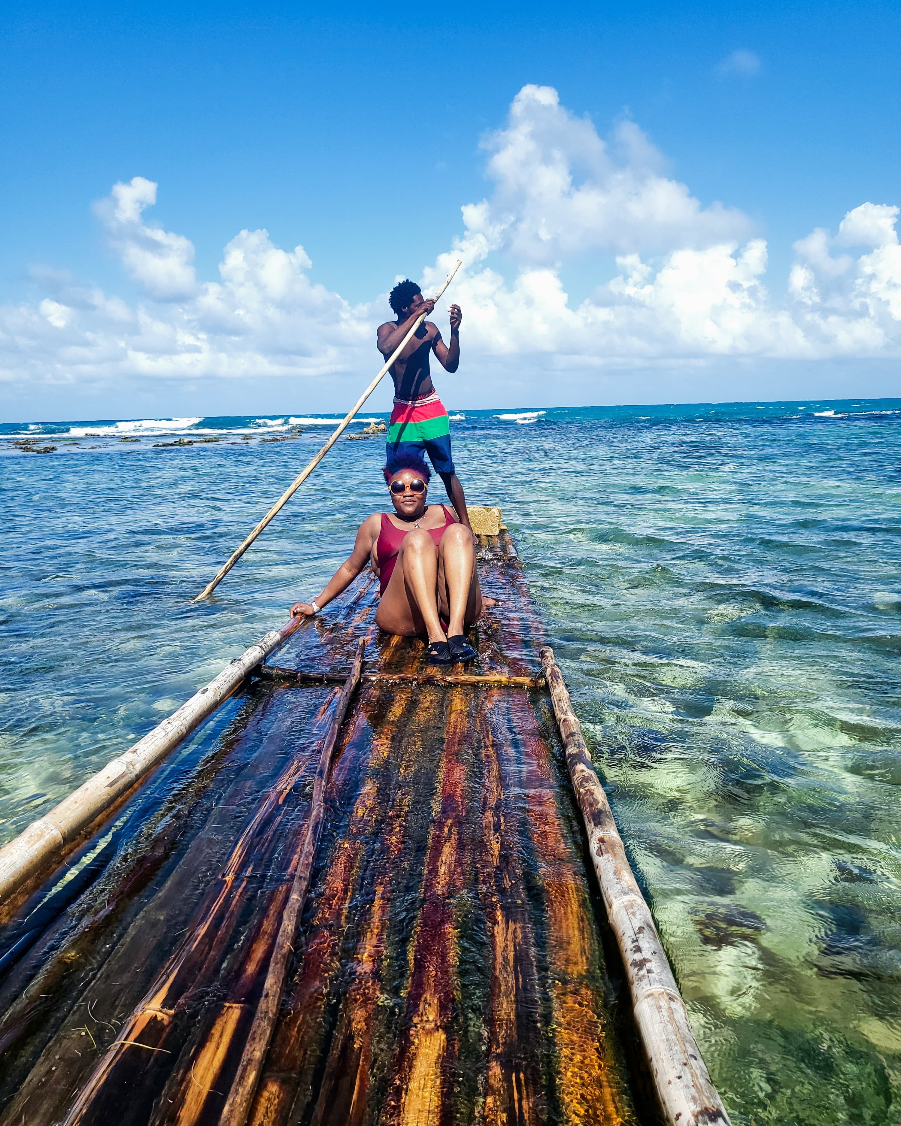 Advisor and a friend on long, wooden paddle board