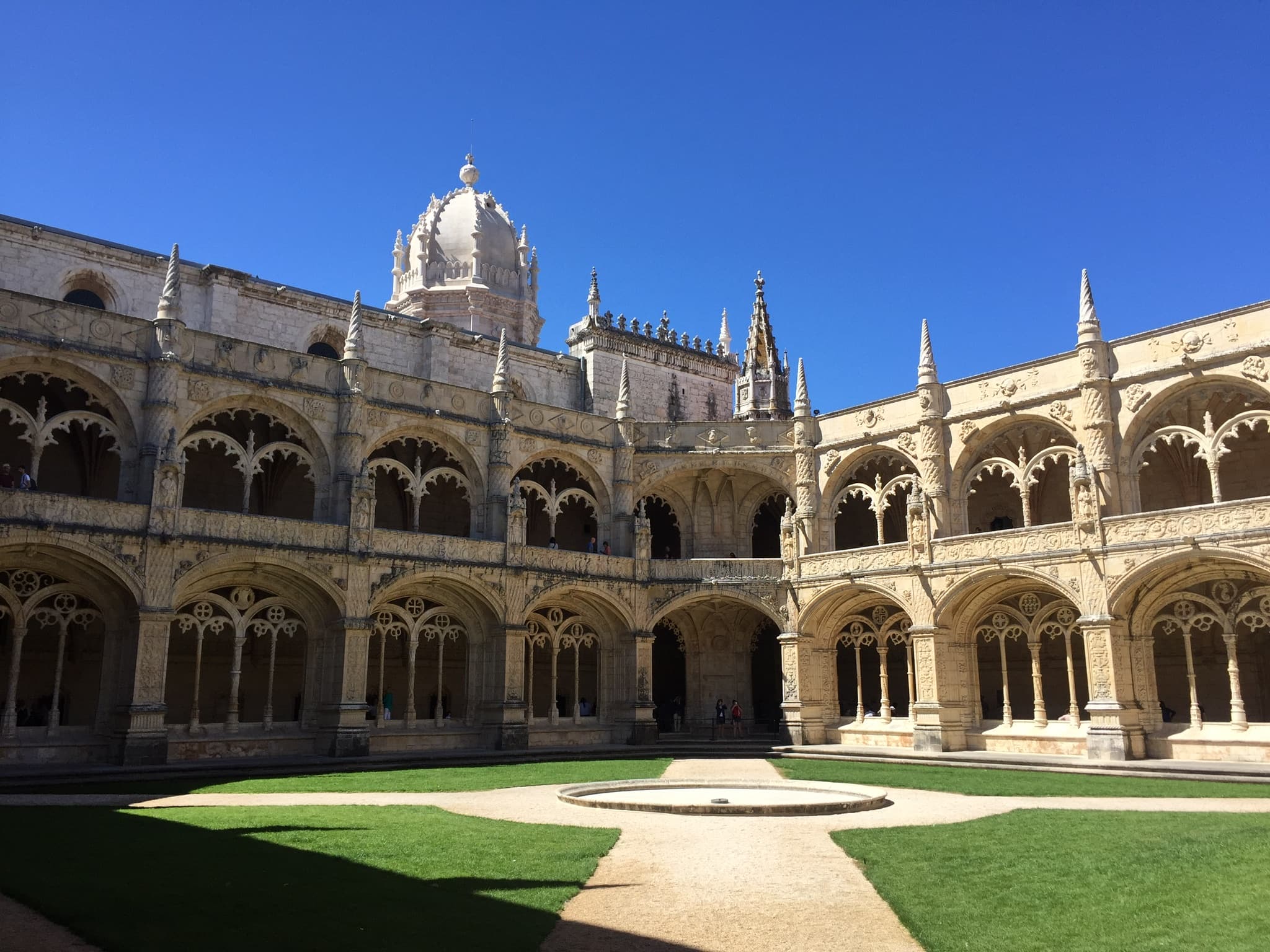 Historical building and dome from the view of a garden on a sunny day