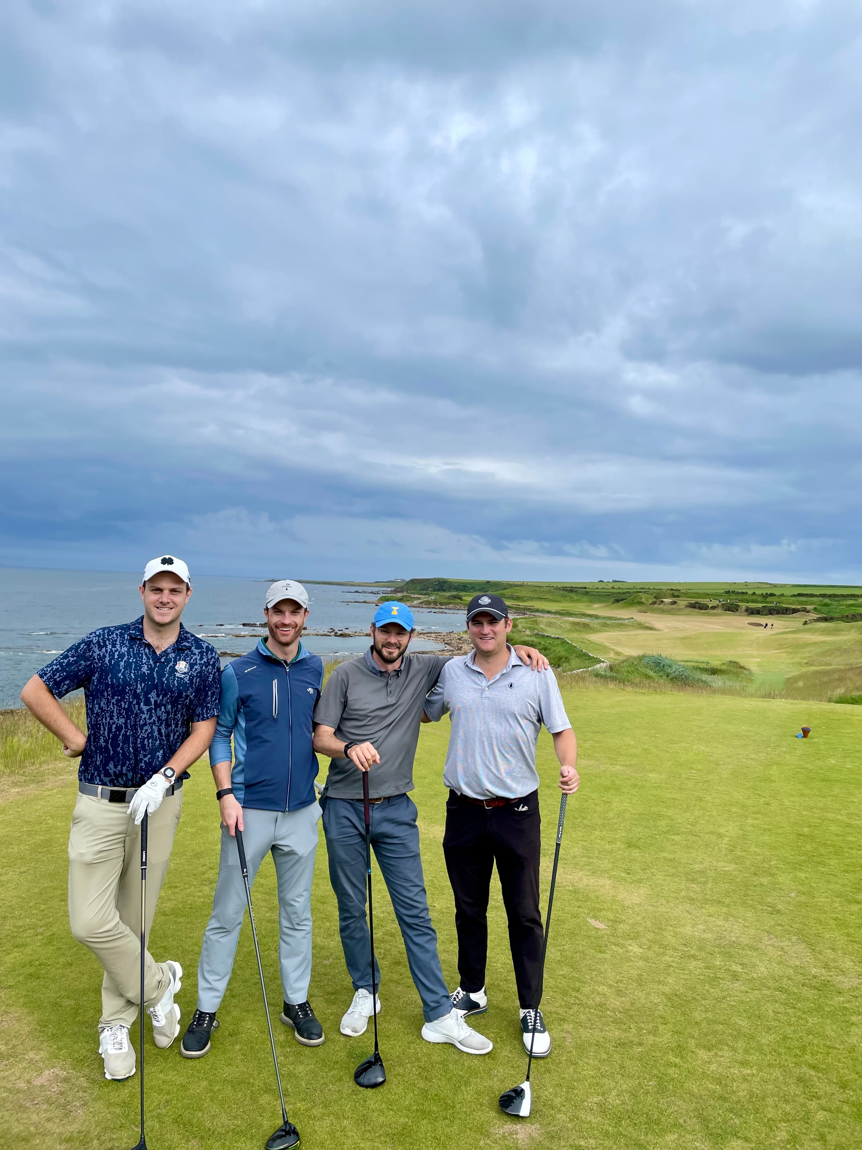 Advisor on a golf course with friends on a cloudy day.