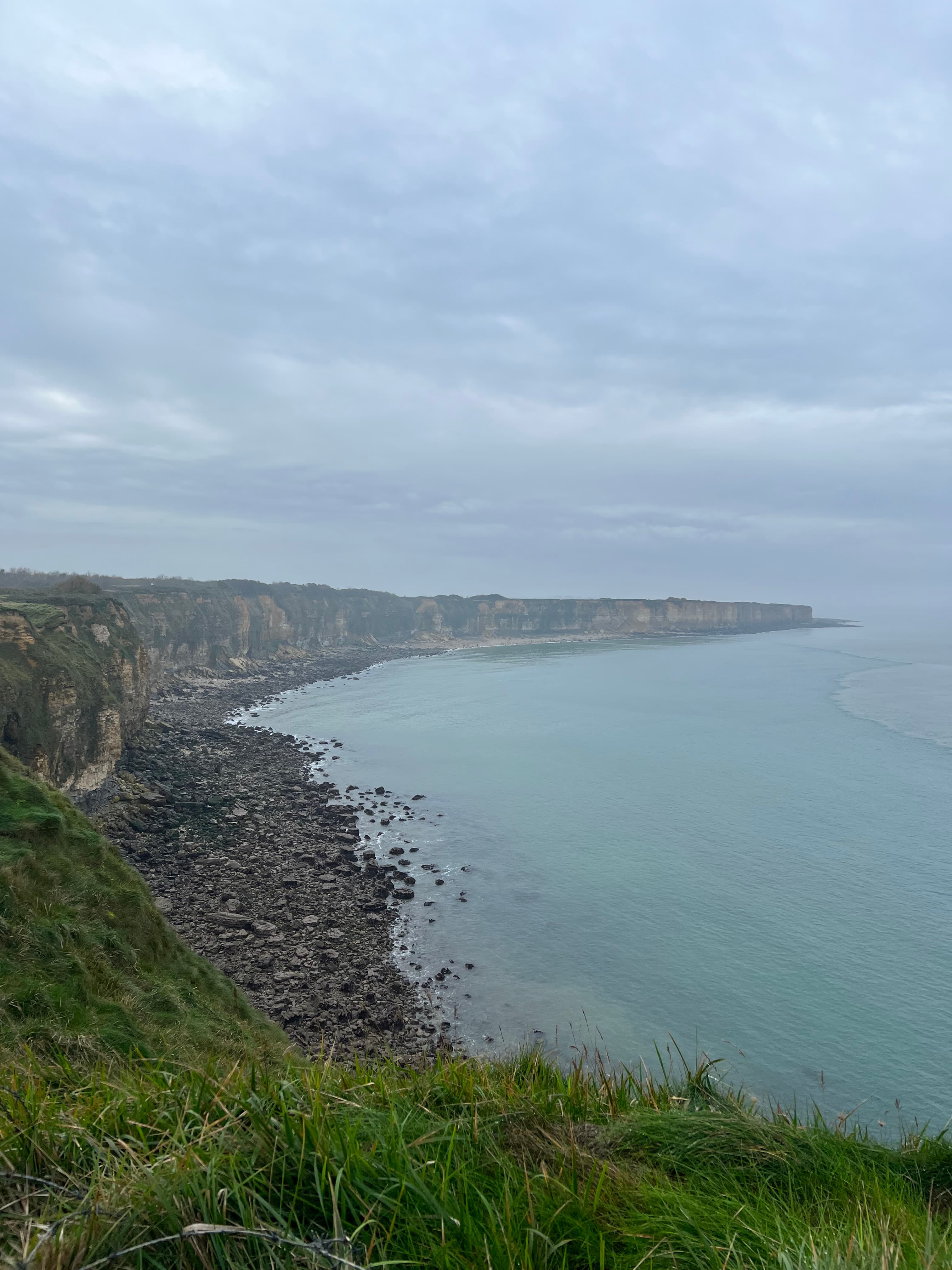 Rocky cliffs and blue ocean.