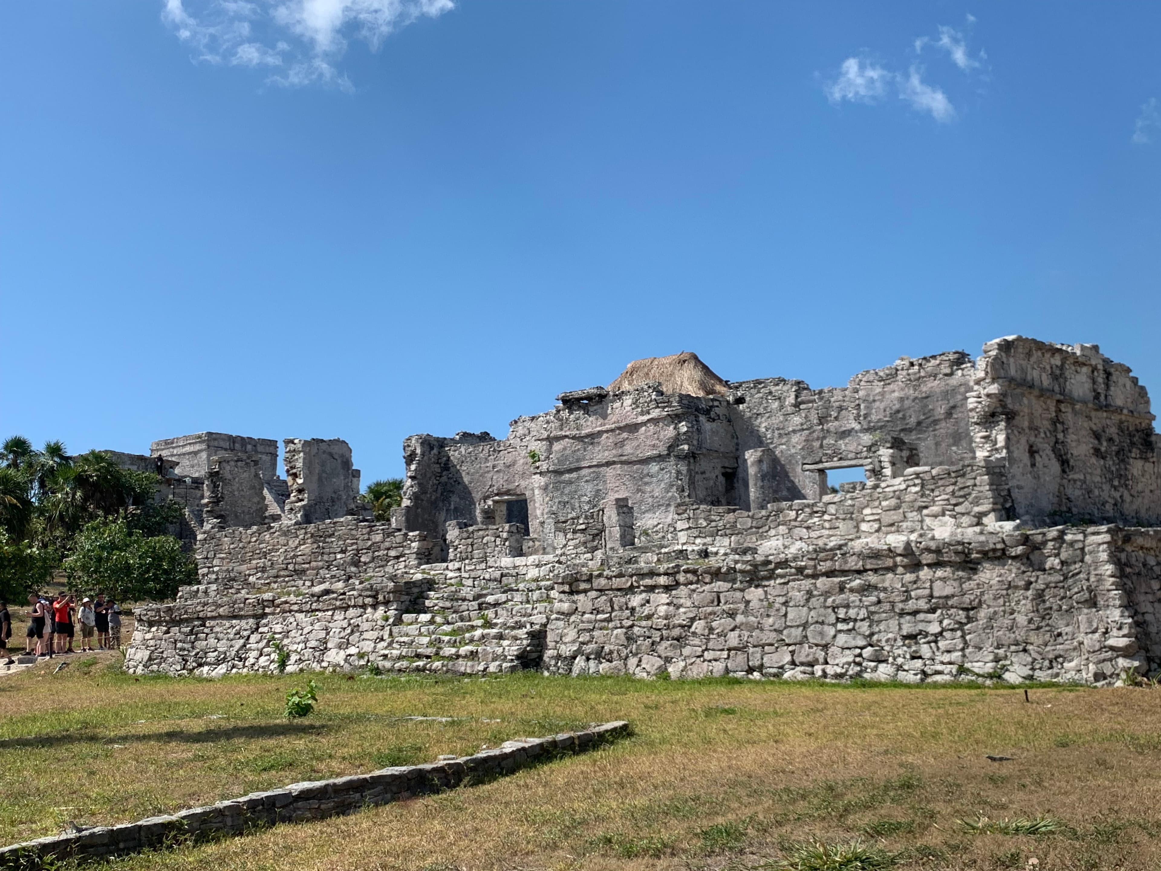Mayan ruins with blue sky in the background.