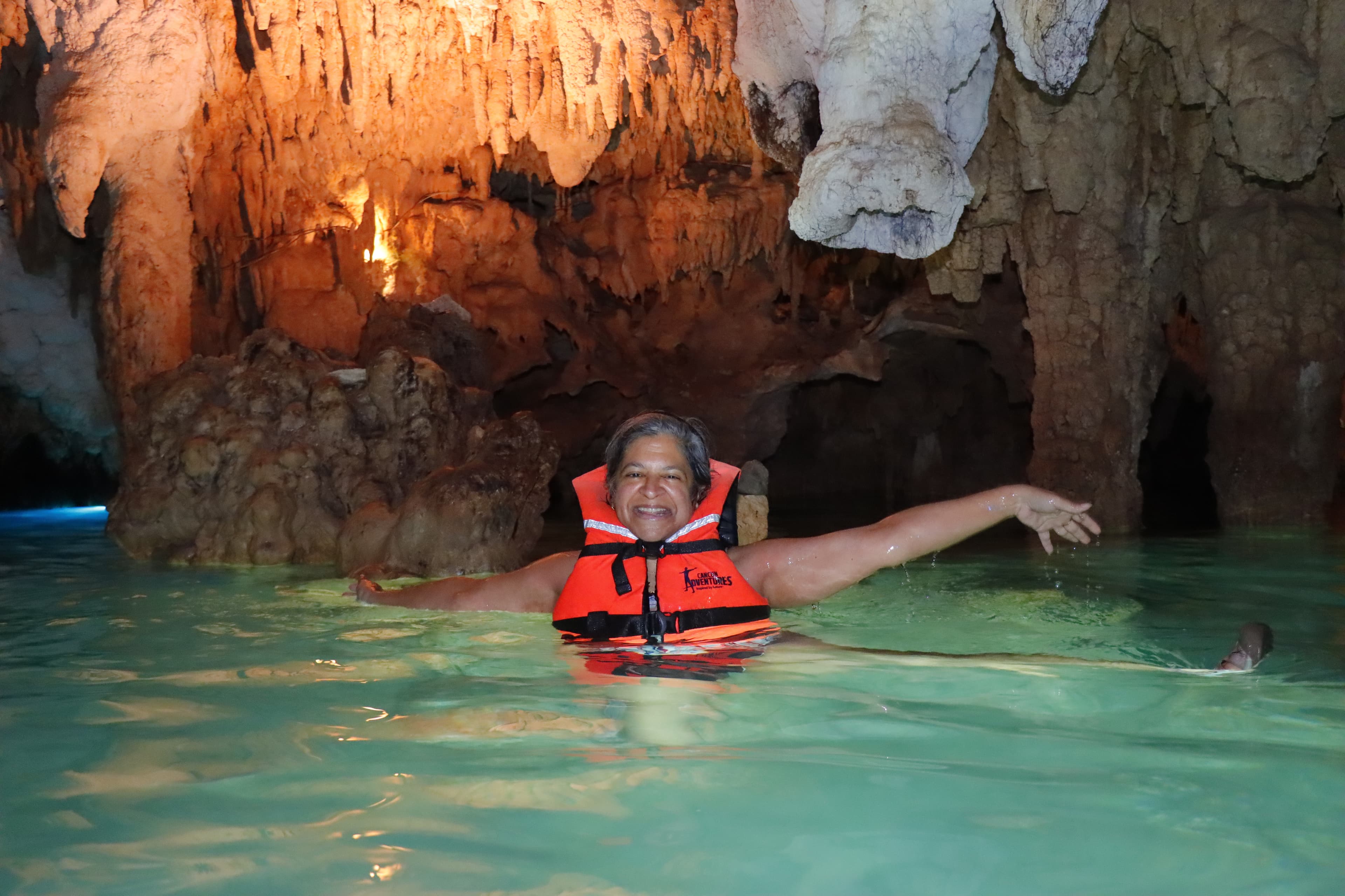 Advisor posing in a cavern.