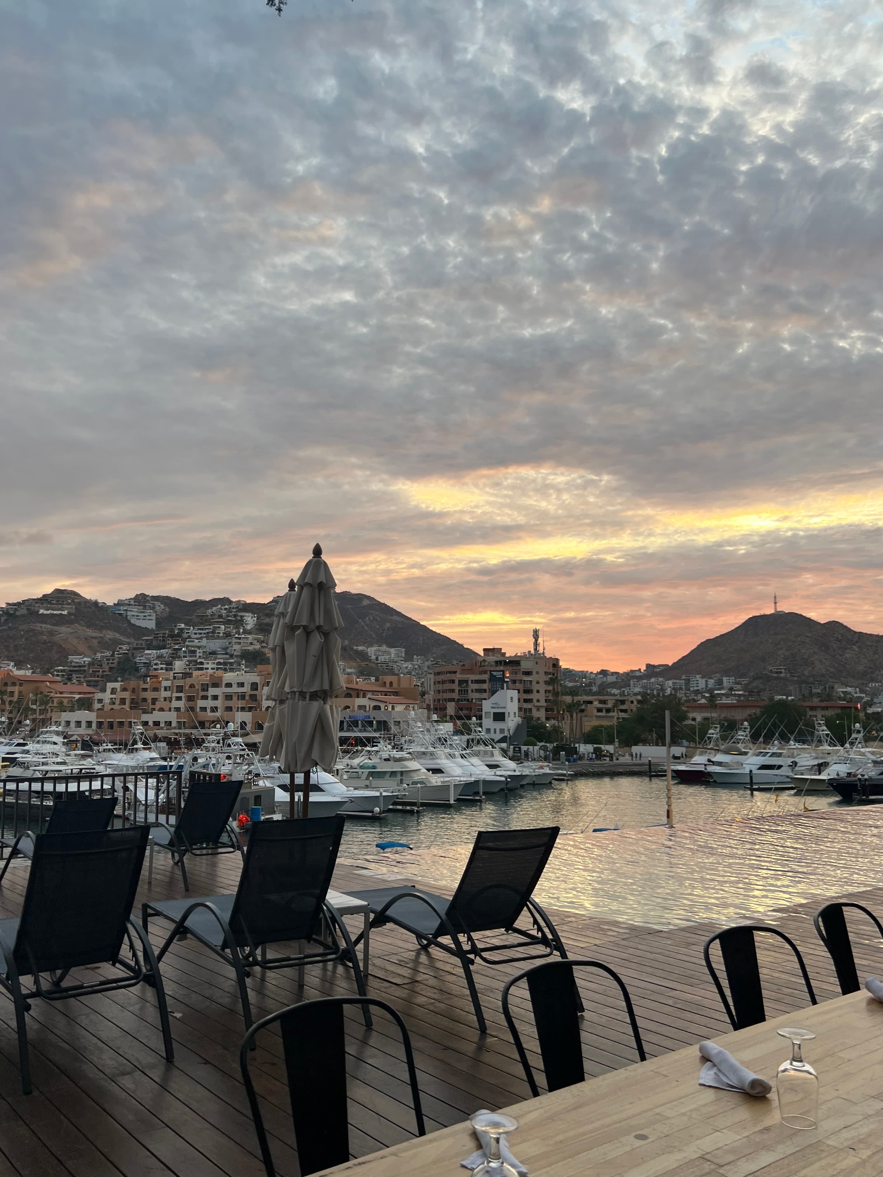Sunset over pool with views of the town.