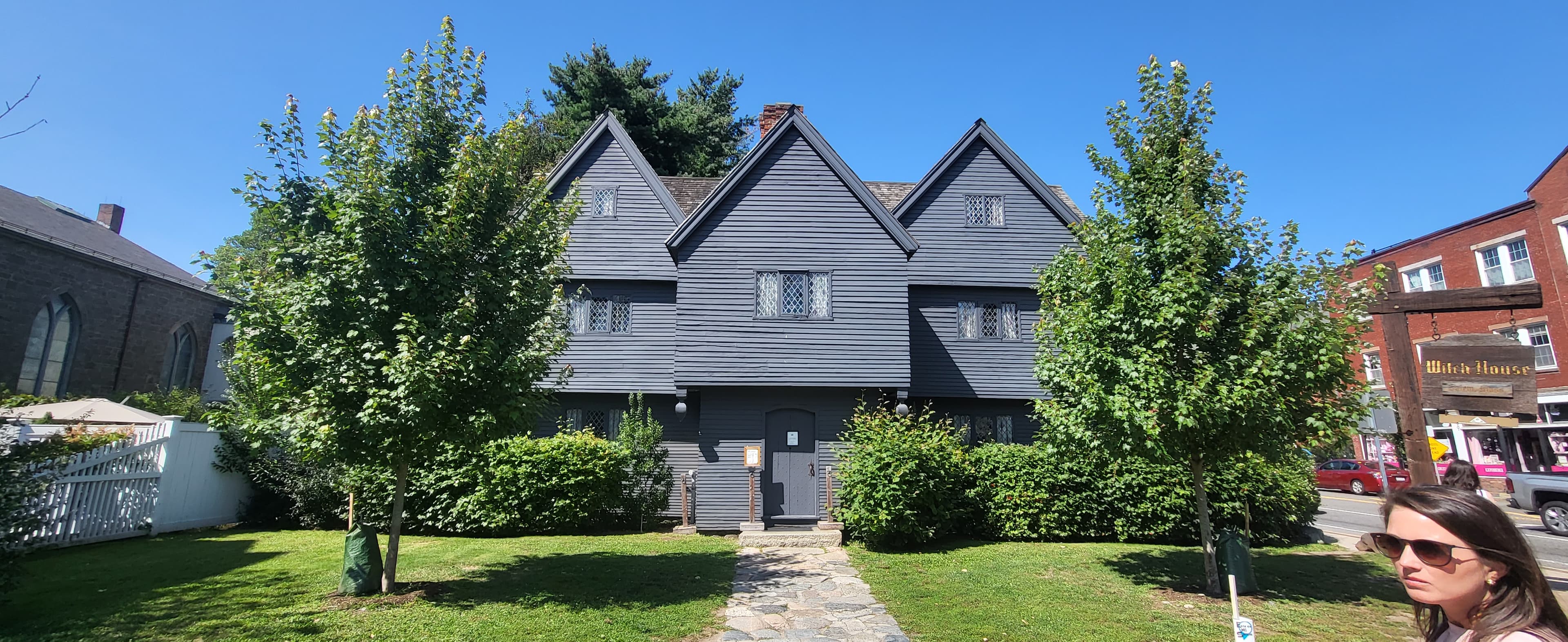 Grey traditional house during the daytime.
