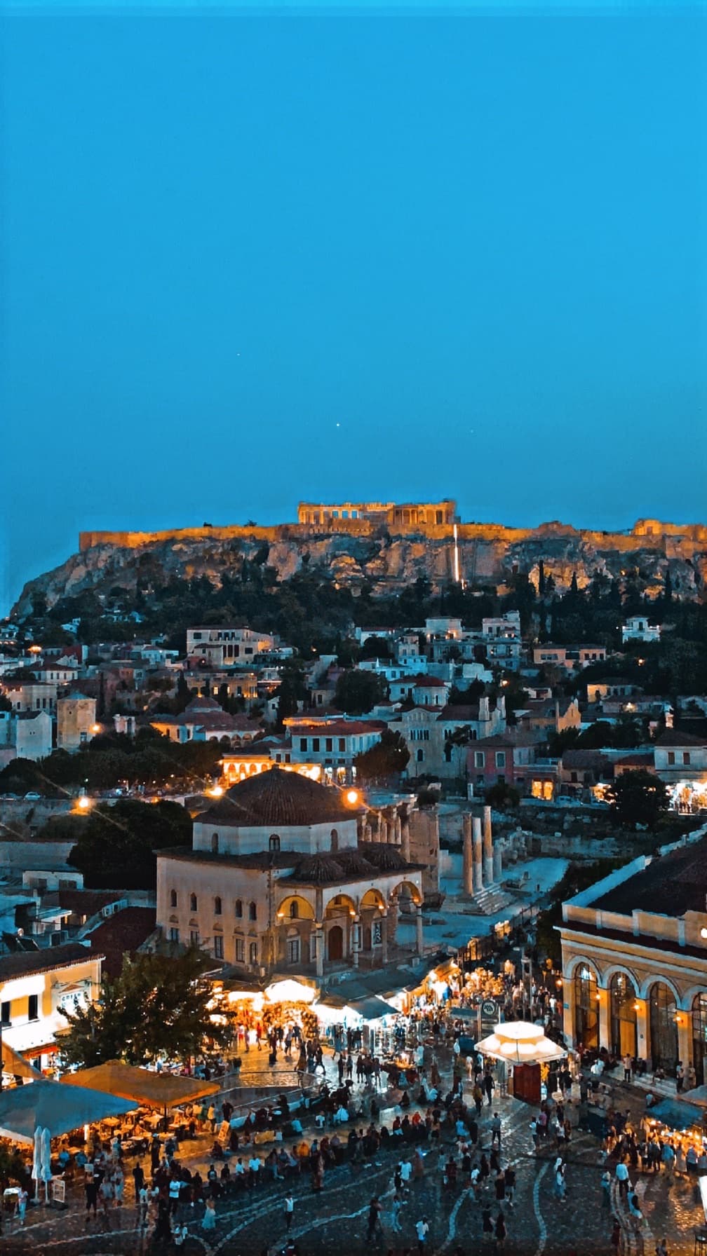 Beautiful aerial view of a cityscape lit up at dusk