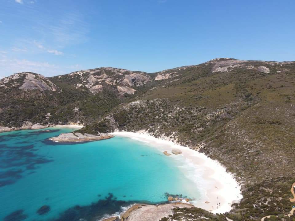 A view of the beach on a sunny day.