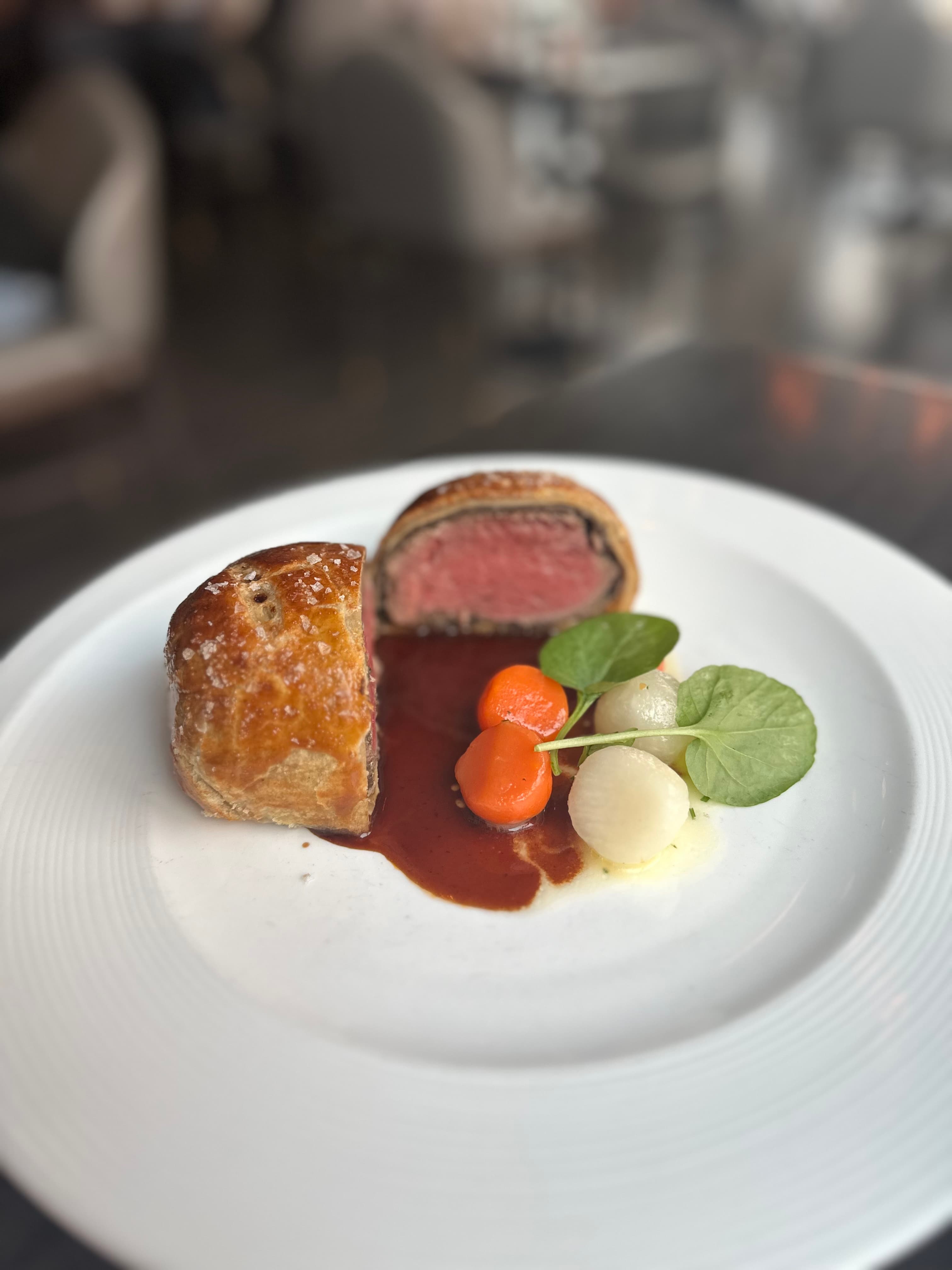View of a fancy meal on a white plate during the day
