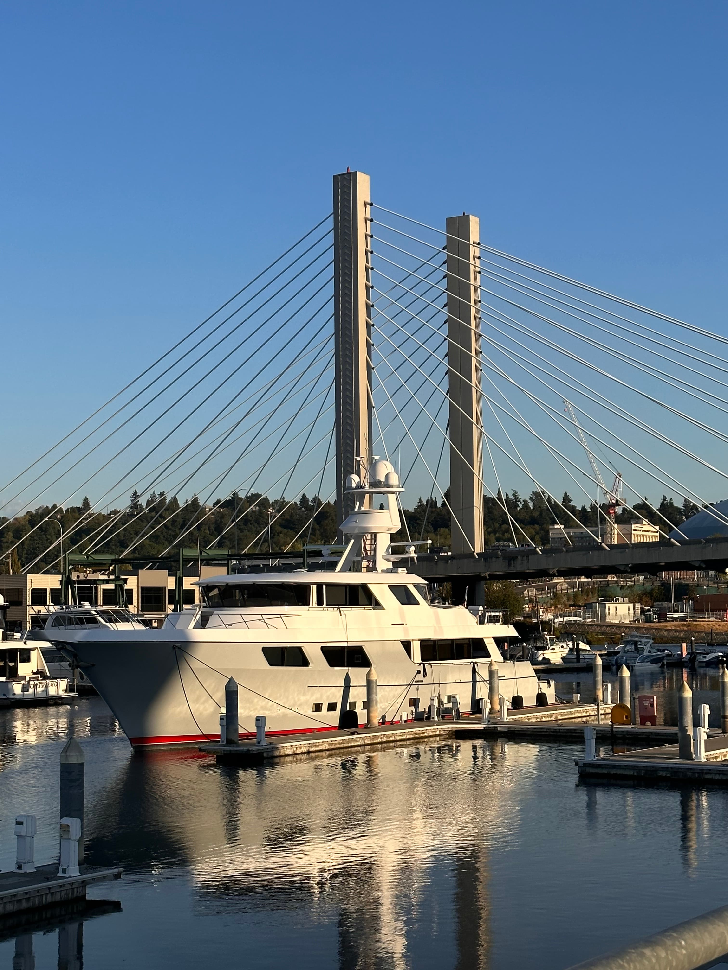 A yacht in the water on a sunny day.
