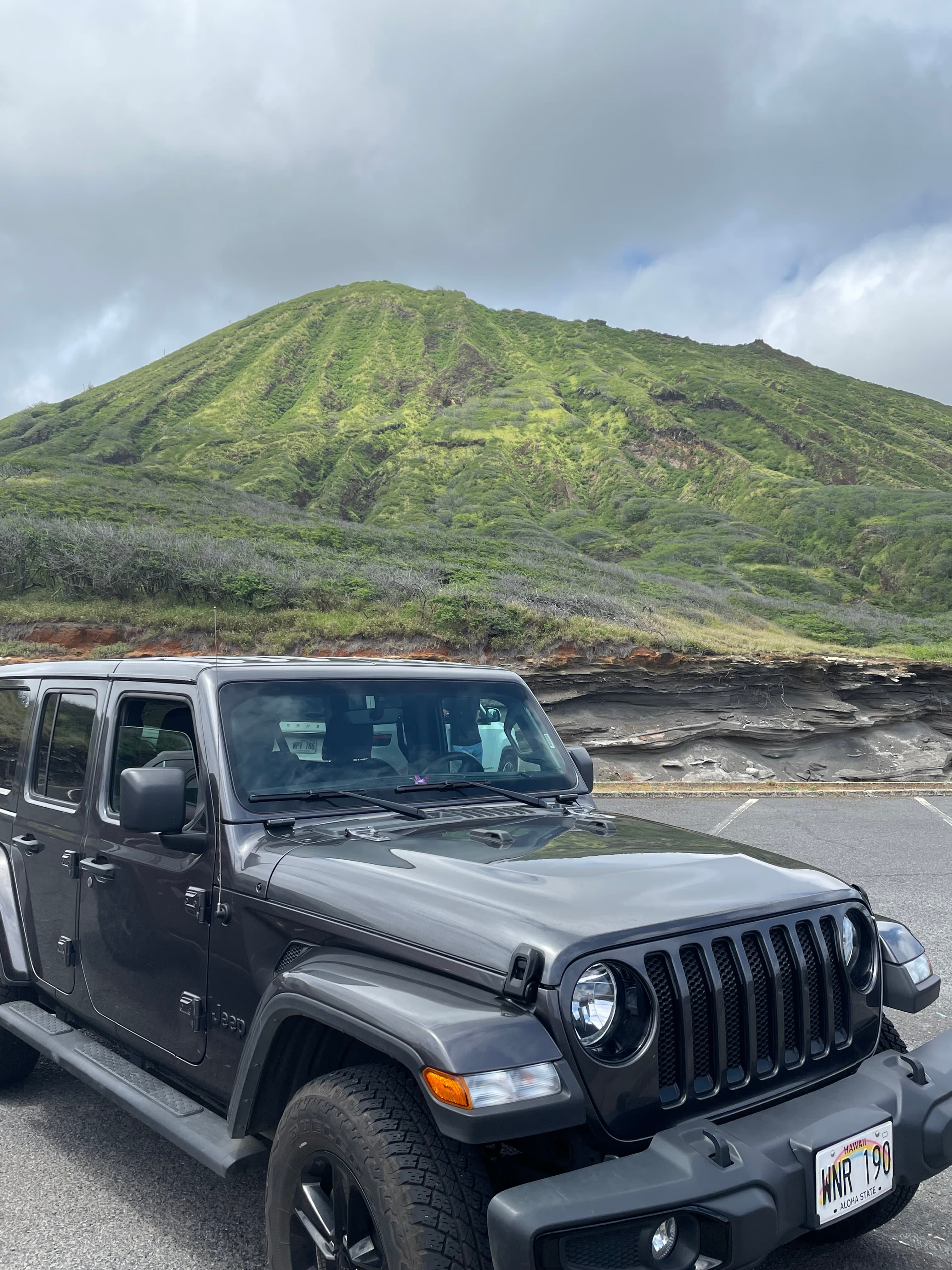 A view of an off roading Jeep during the daytime.