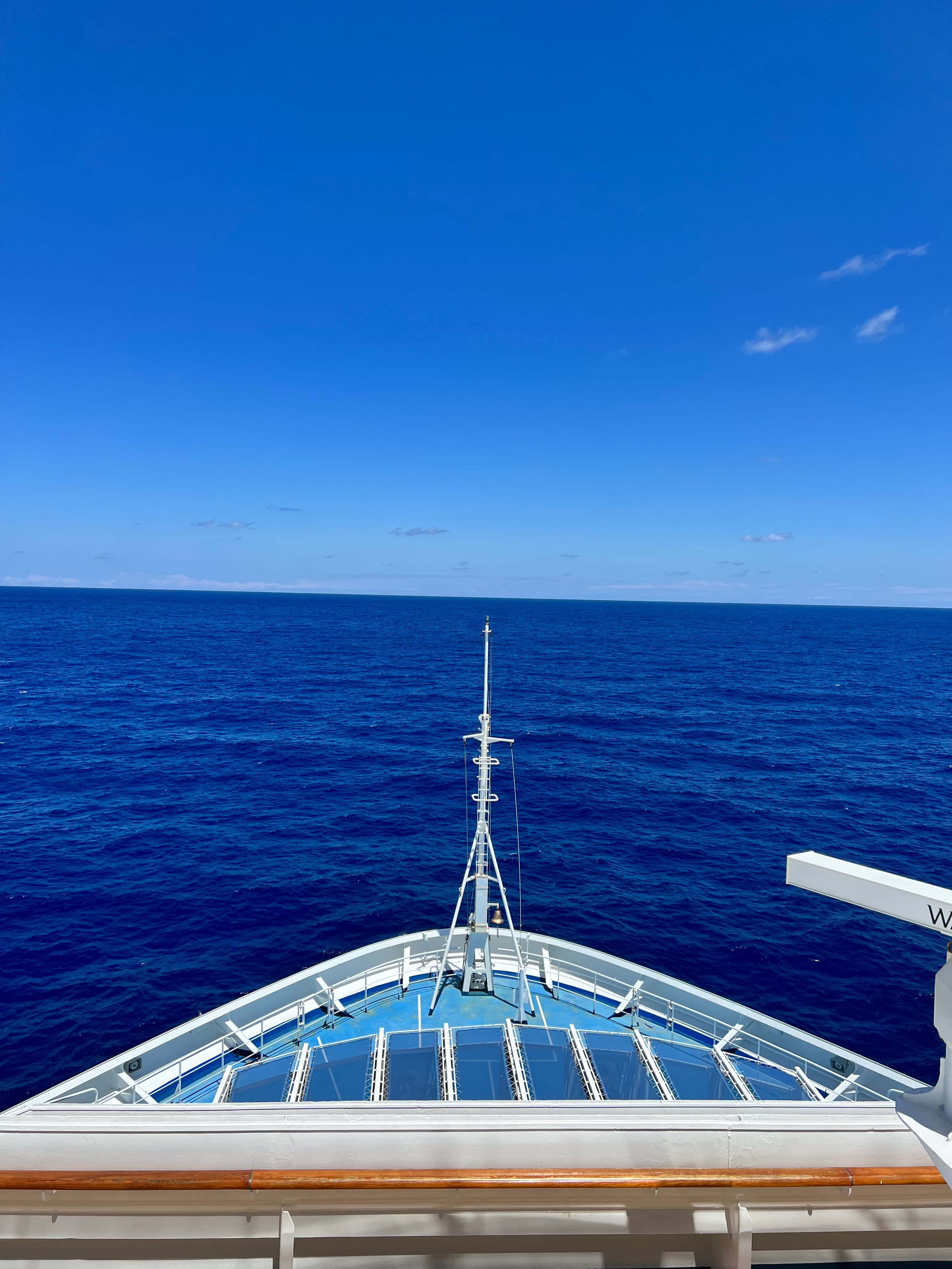 An image of the ocean from a boat during the day.