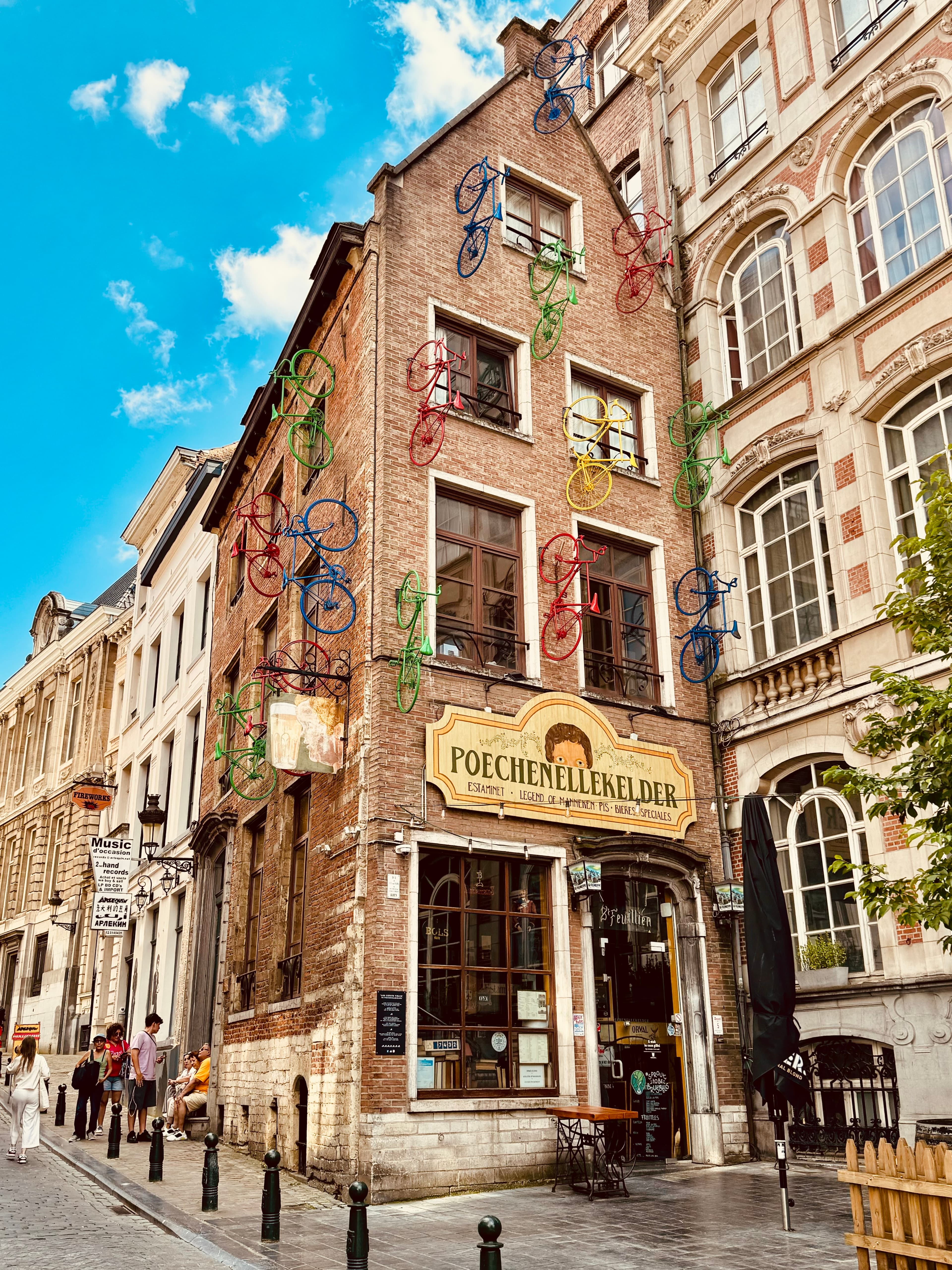 View of a old city street lined with pretty buildings on a sunny day