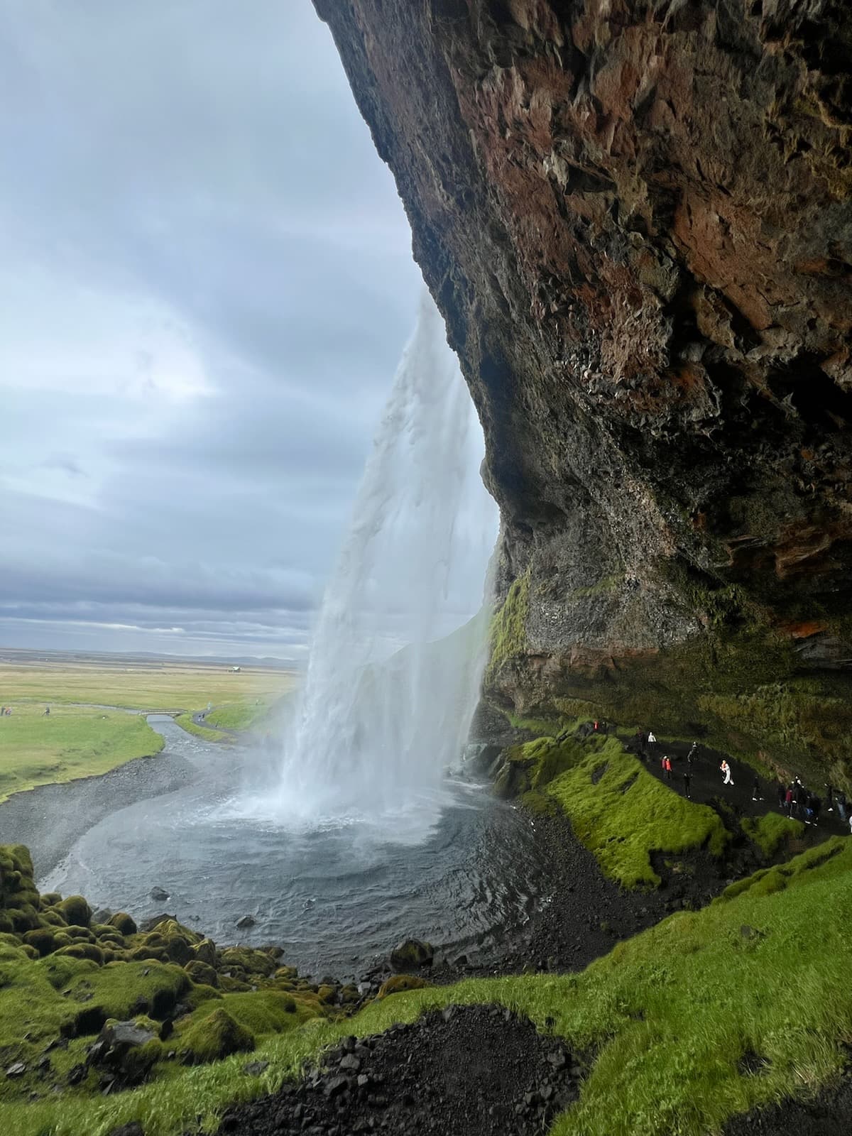 Waterfall over grass.