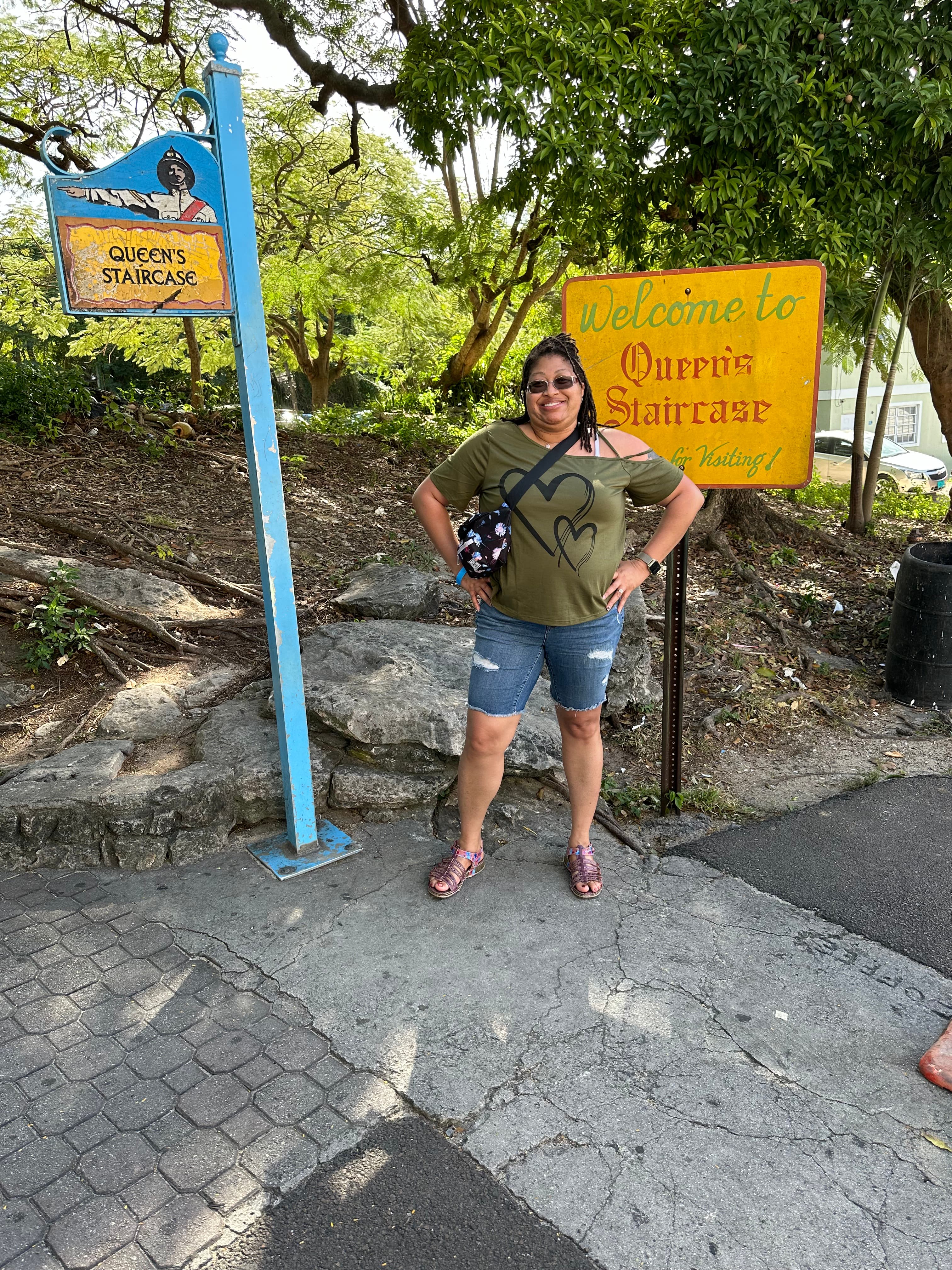 Lady in front of a sign.