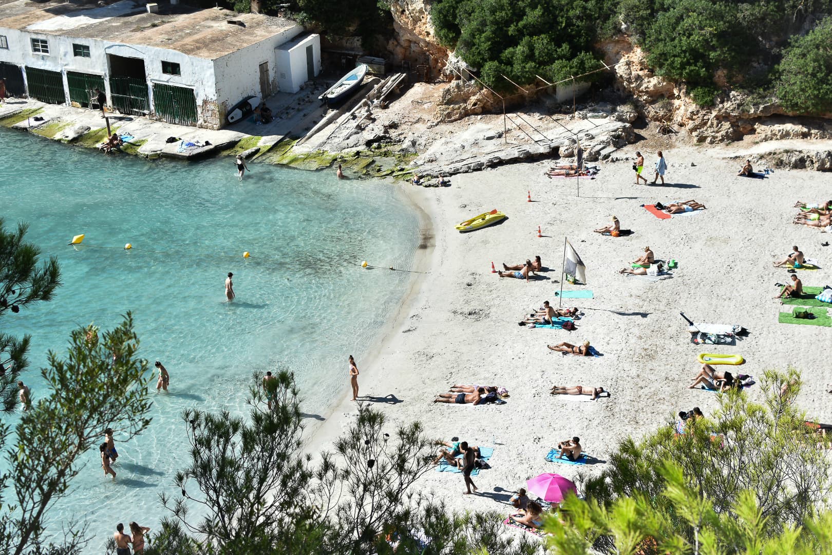 People enjoying the beach on a sunny day.
