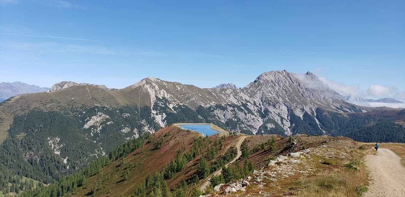 View of tall mountain peaks during the daytime.
