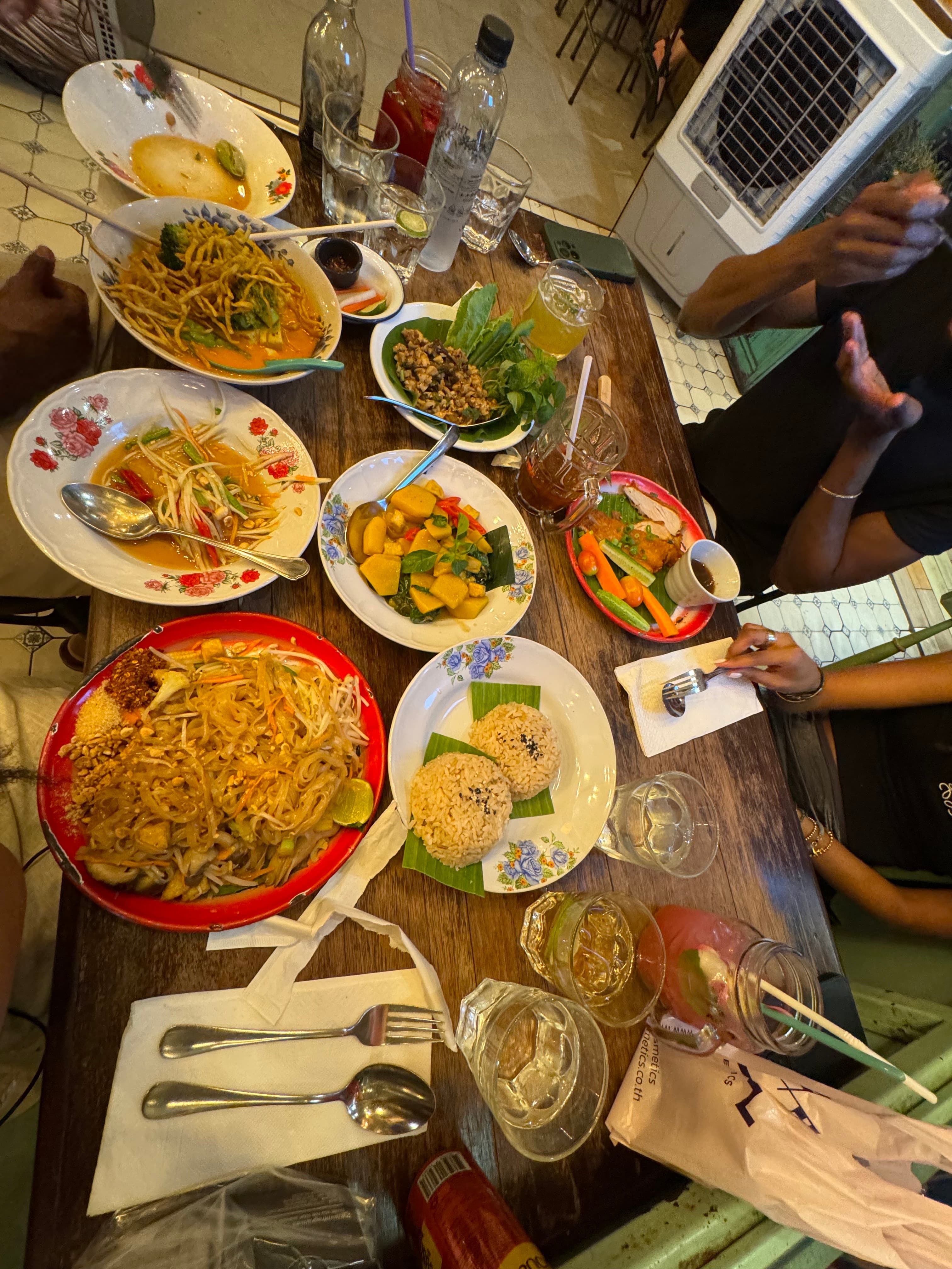 Overhead view of a table full of plates of food