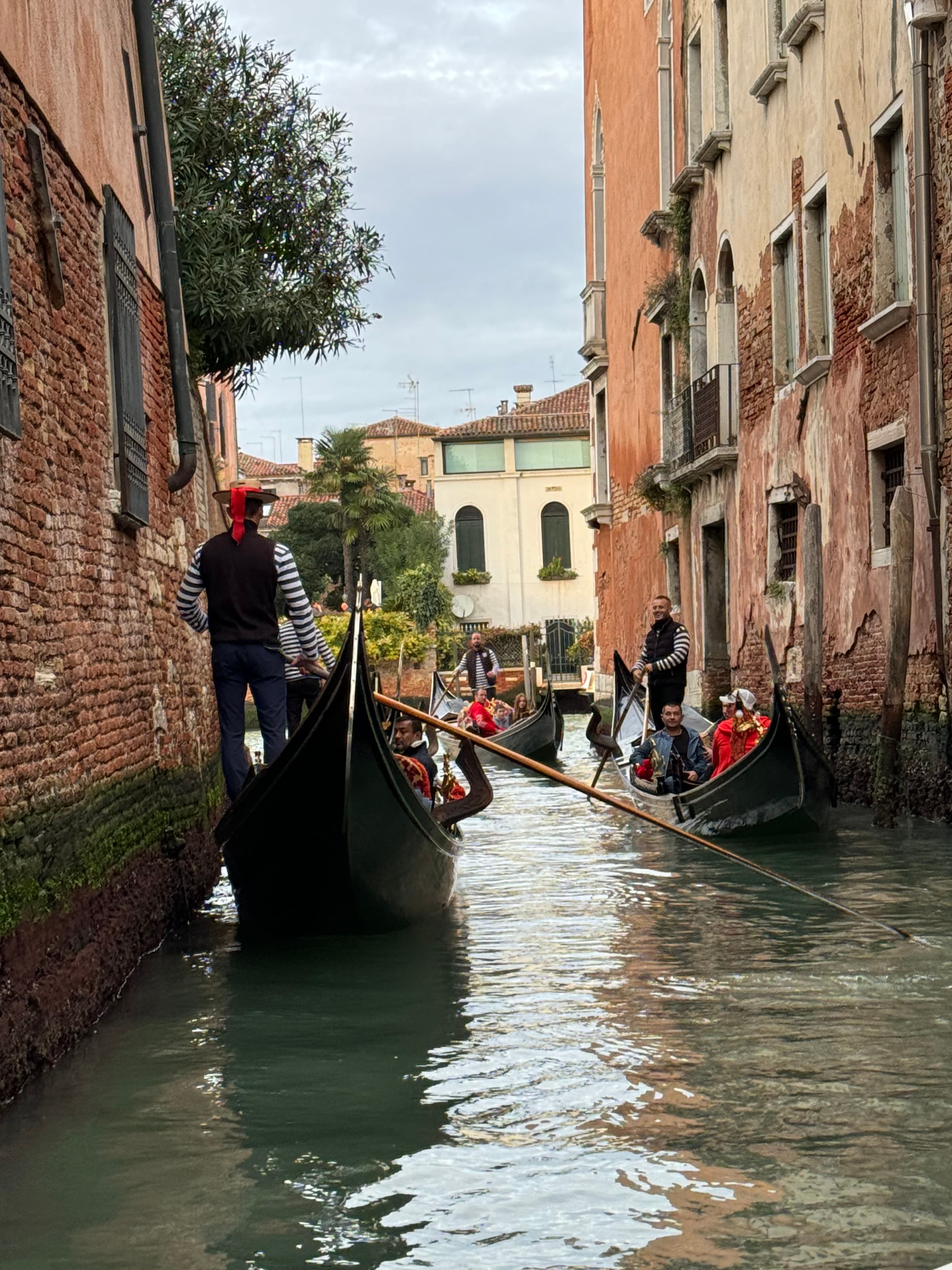 A canal with boats in Venice.