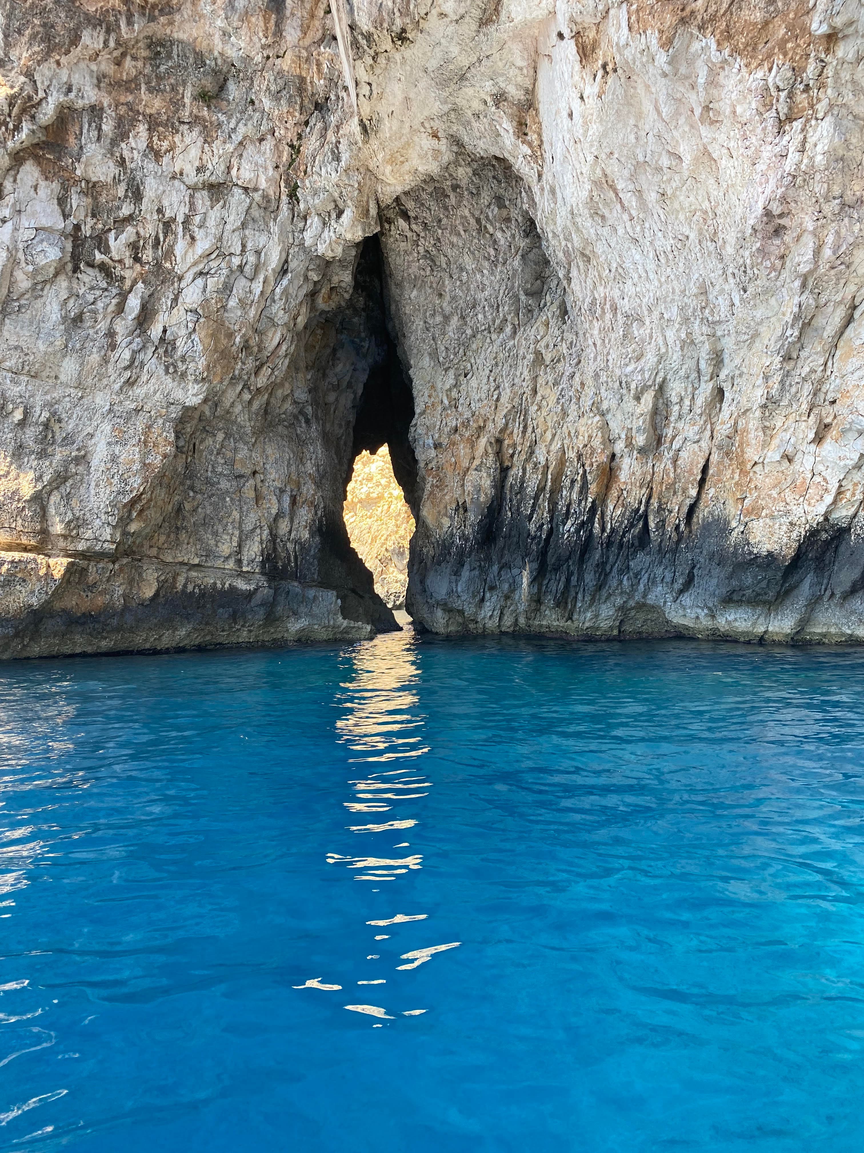 View of a body of water with a rock in view.