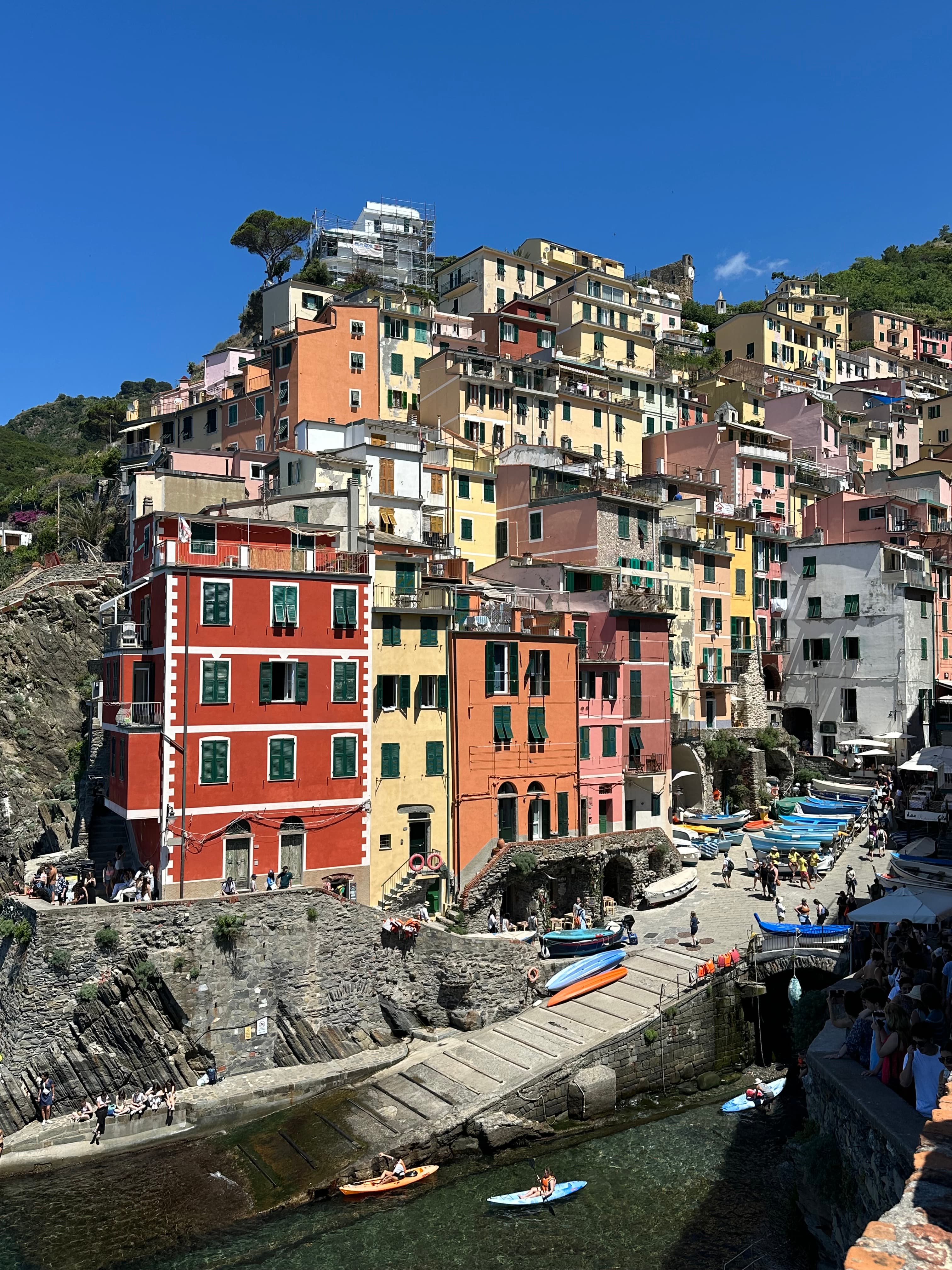 Beautiful view of colorful buildings along a rocky coast on a sunny afternoon