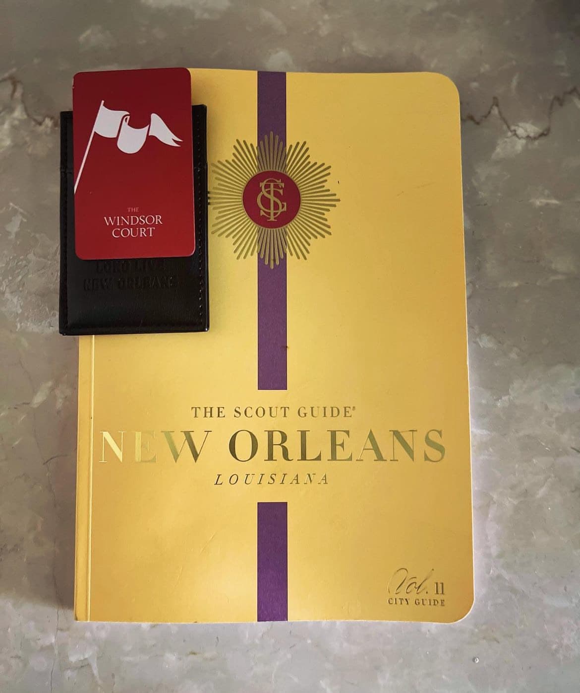 View of a yellow book “The Scout Guide New Orleans” on a table
