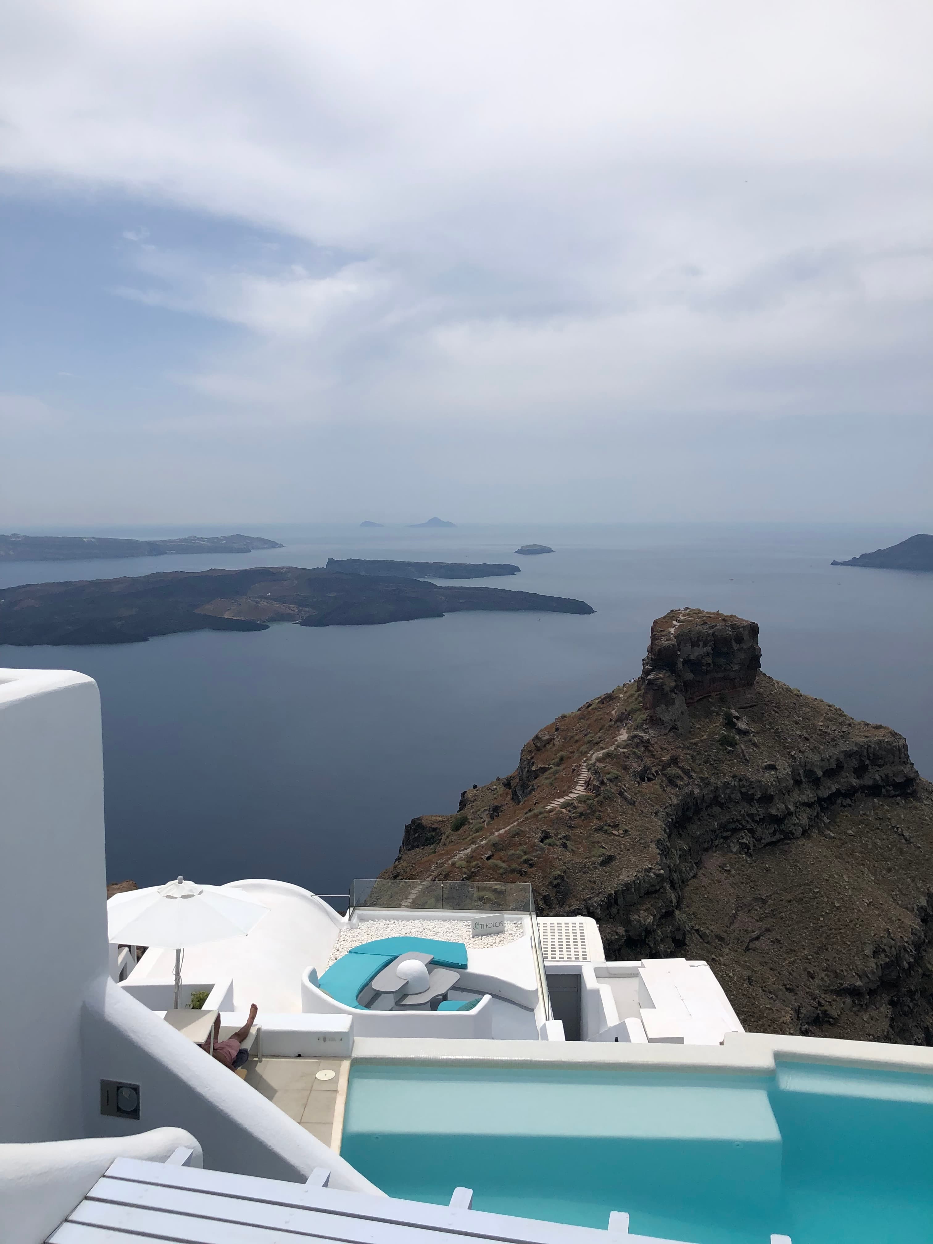 Infinity pool overlooking the sea on a cloudy day