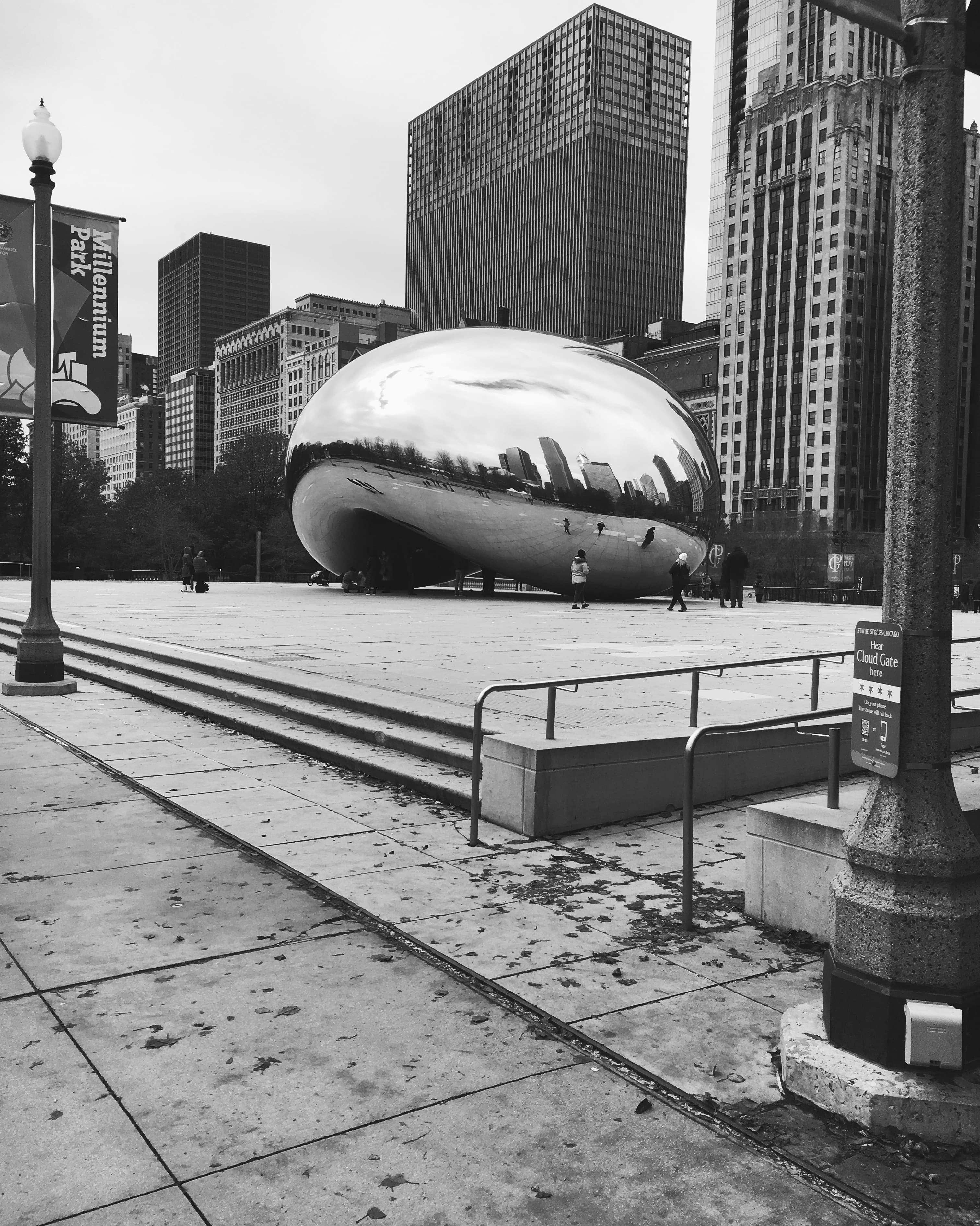 Black and white photo of the Bean in Chicago on a cloudy day