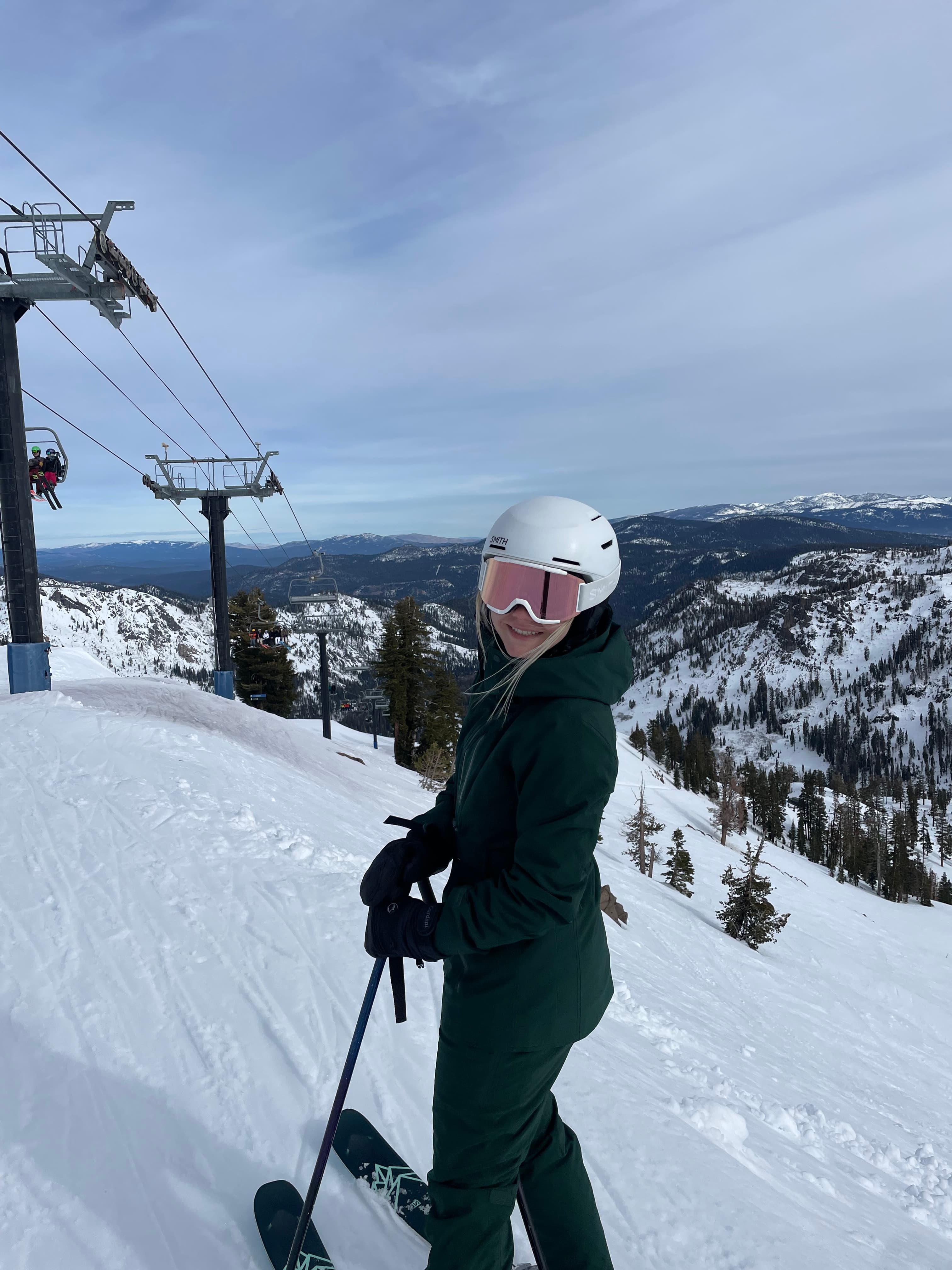Advisor in ski gear and goggles on the slopes