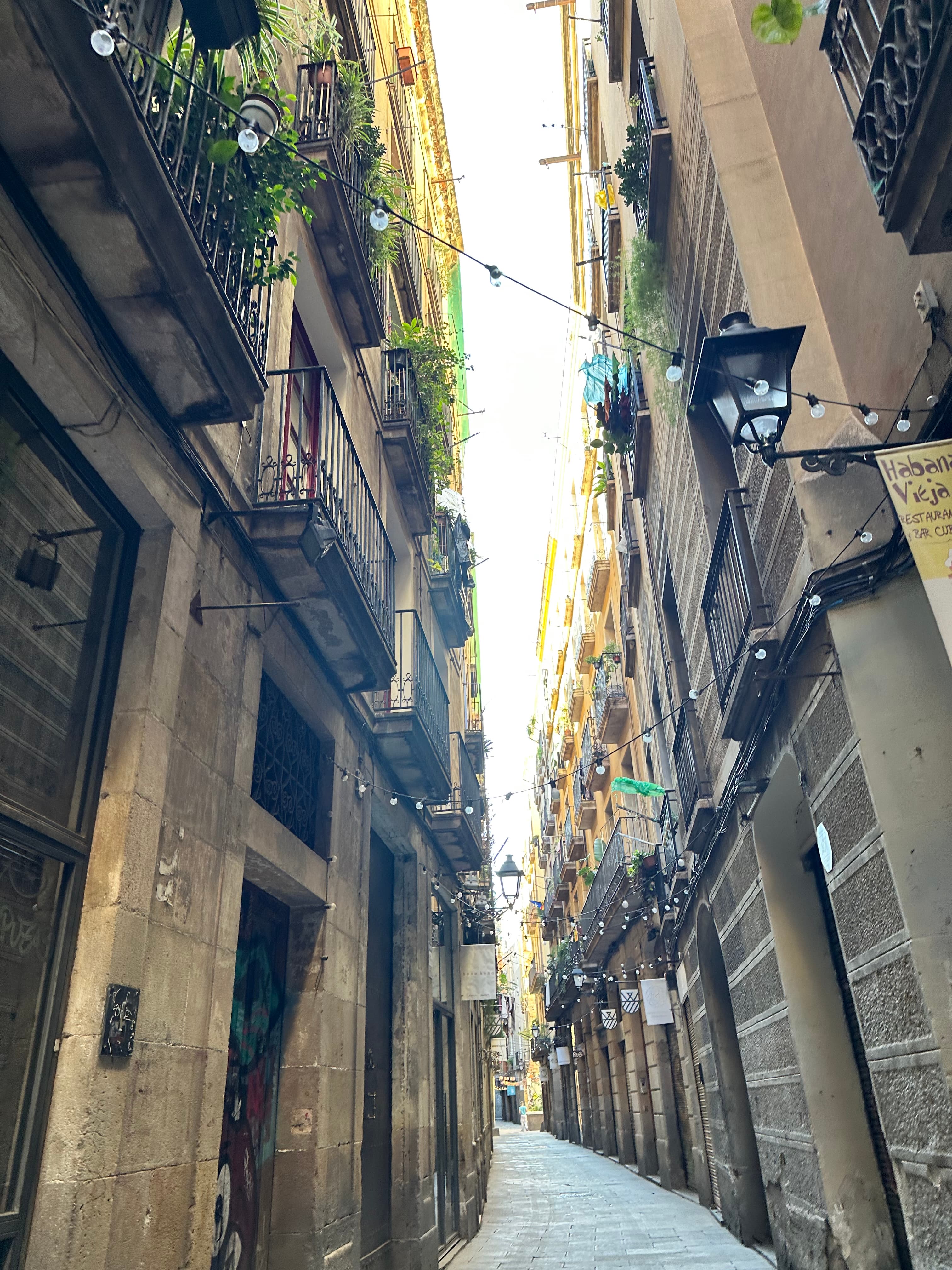 View of a narrow street in Barcelona on a sunny day