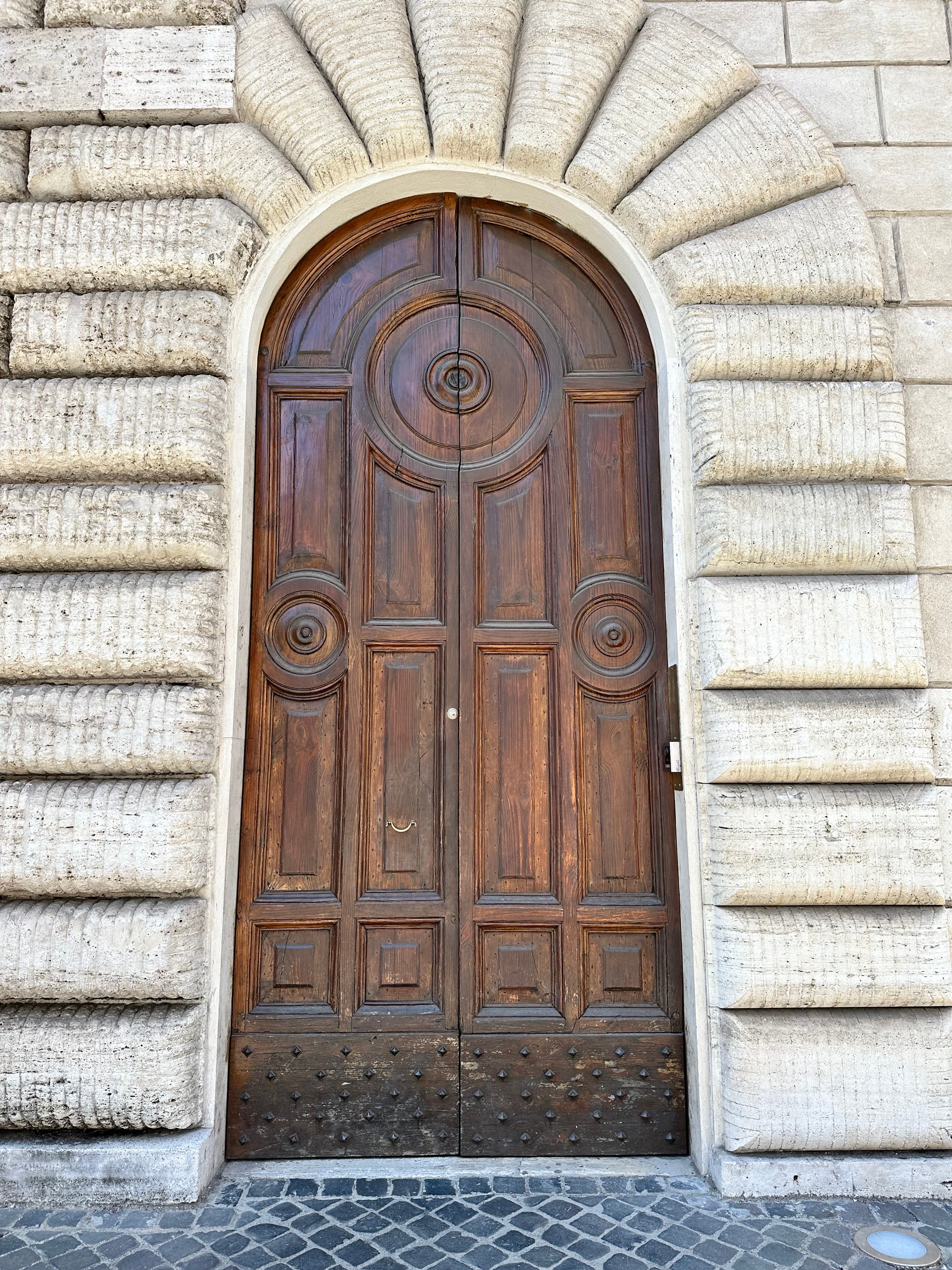 View of a large wooden door outside during the day