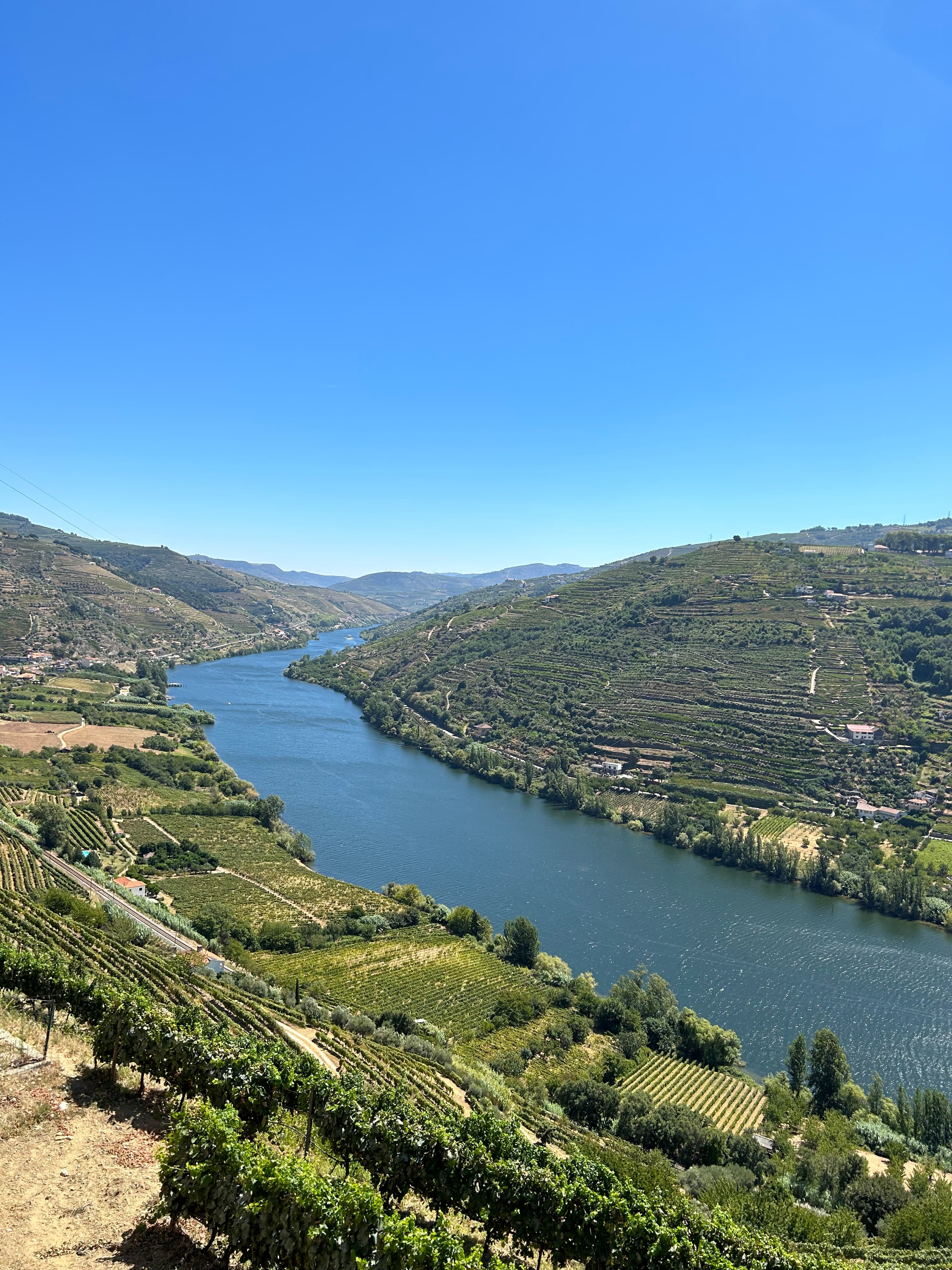 A lake in between mountains during the daytime.