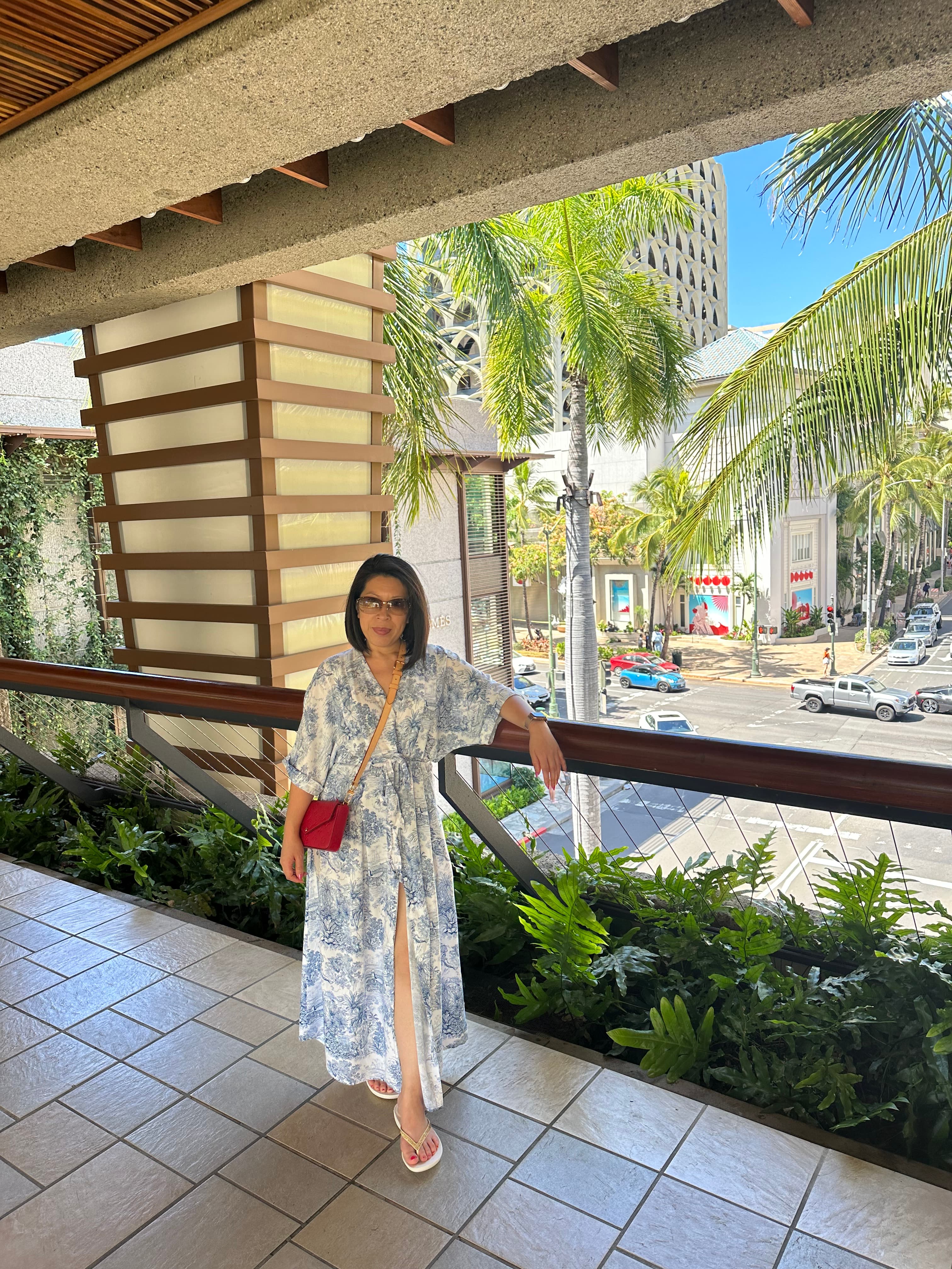 Advisor in a long dress standing outdoors on a sunny day