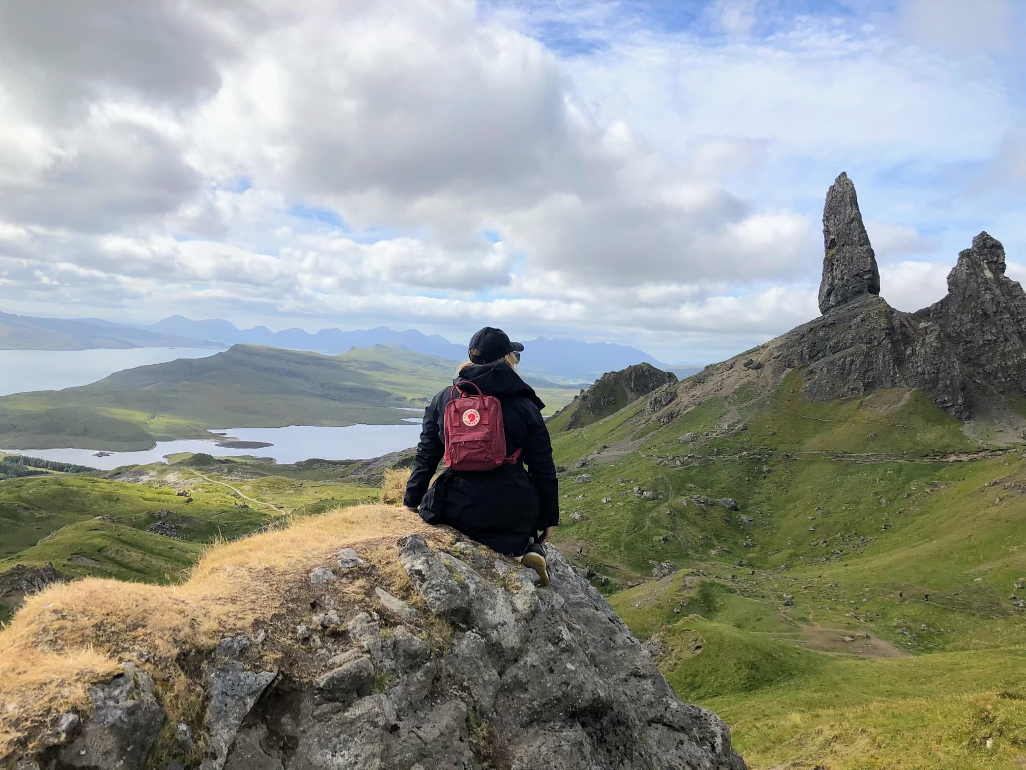 Advisor on a hike through a beautiful green mountain landscape