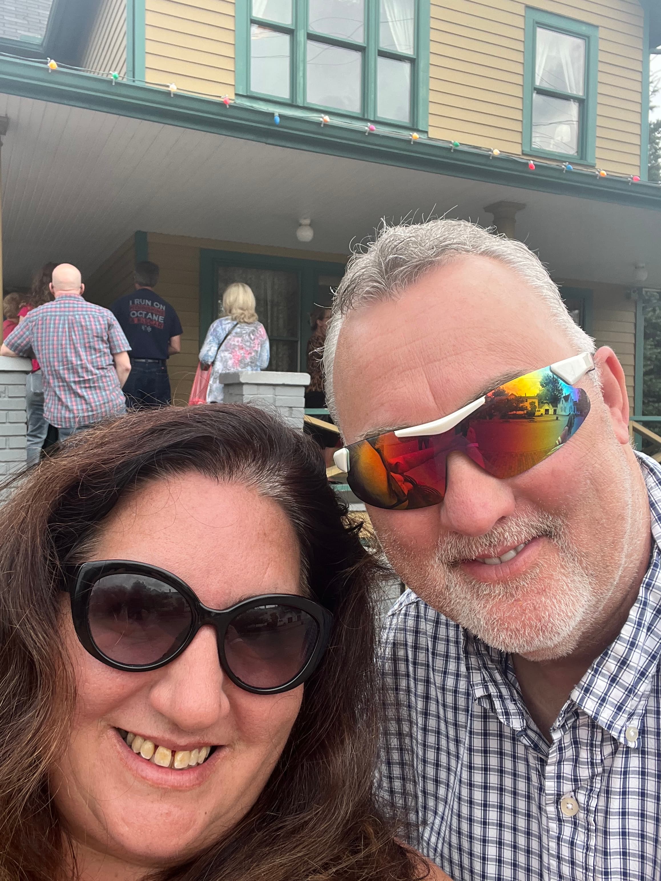 Selfie of a man and a woman both wearing sunglasses.