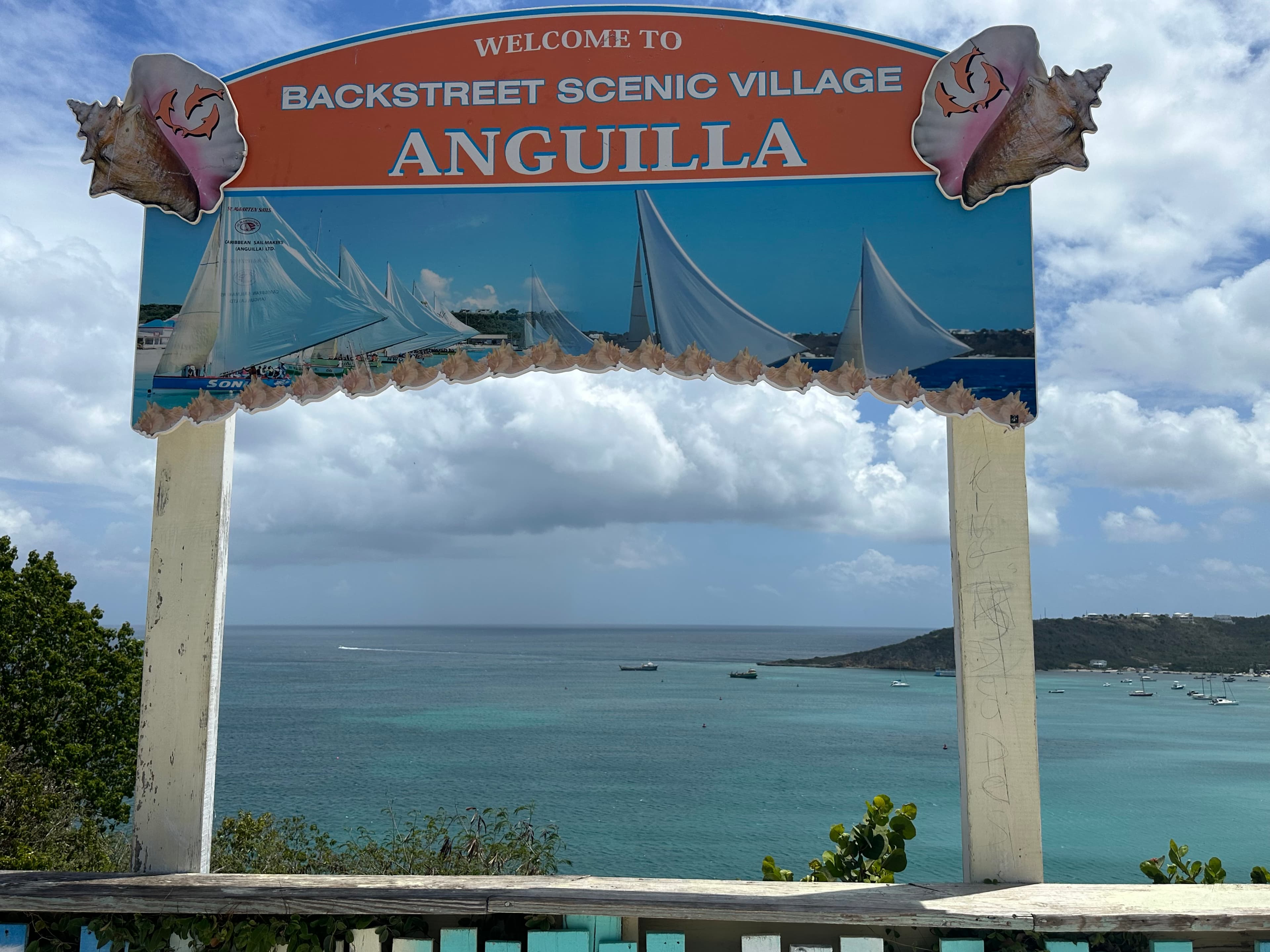 A sign that says, "welcome to backstreet scenic village anguilla".