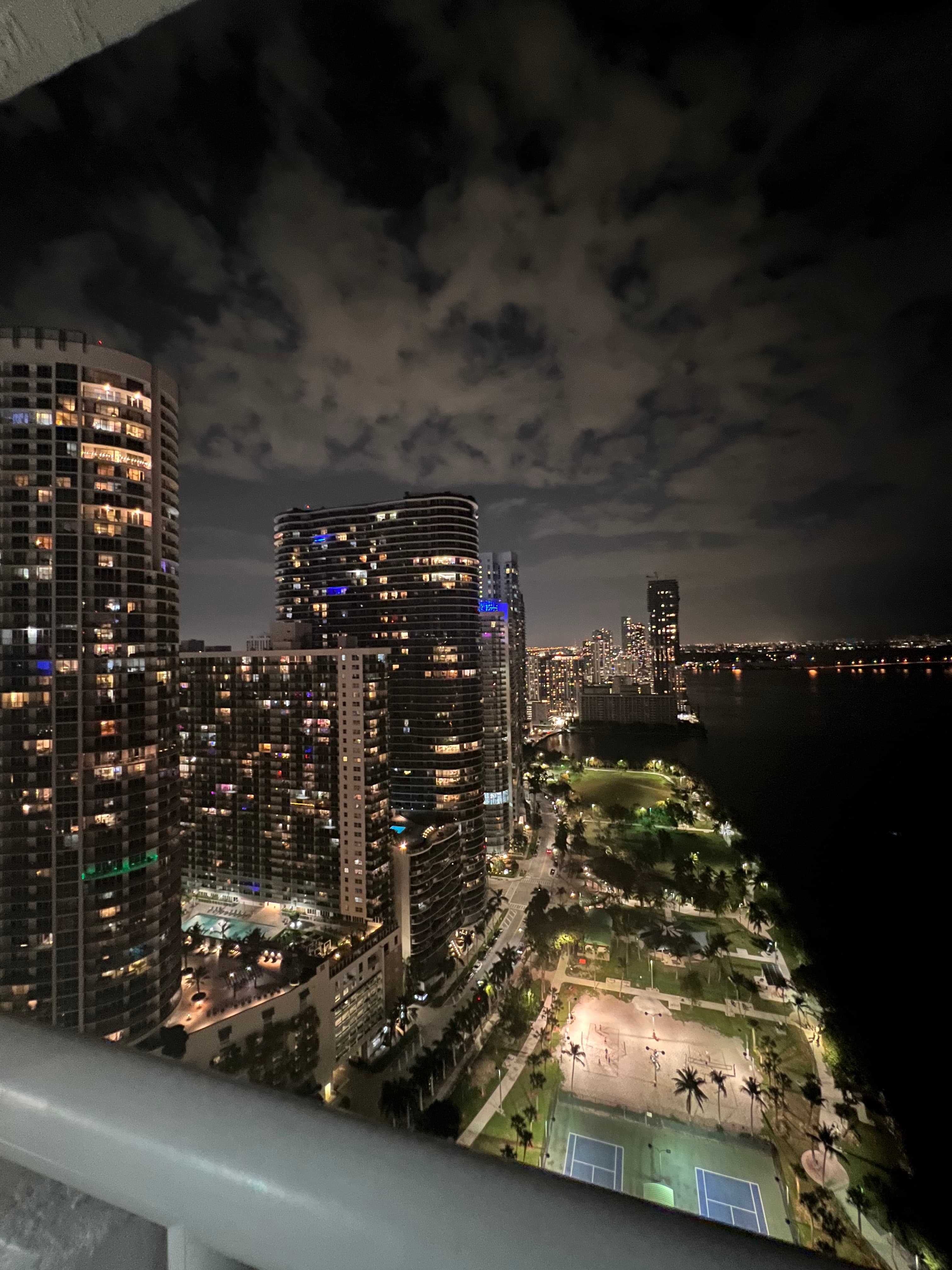 Skyline view of lit up buildings in the city during the nighttime.