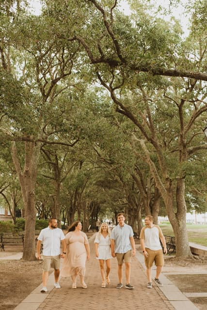 Jenni and family posing for family portrait.