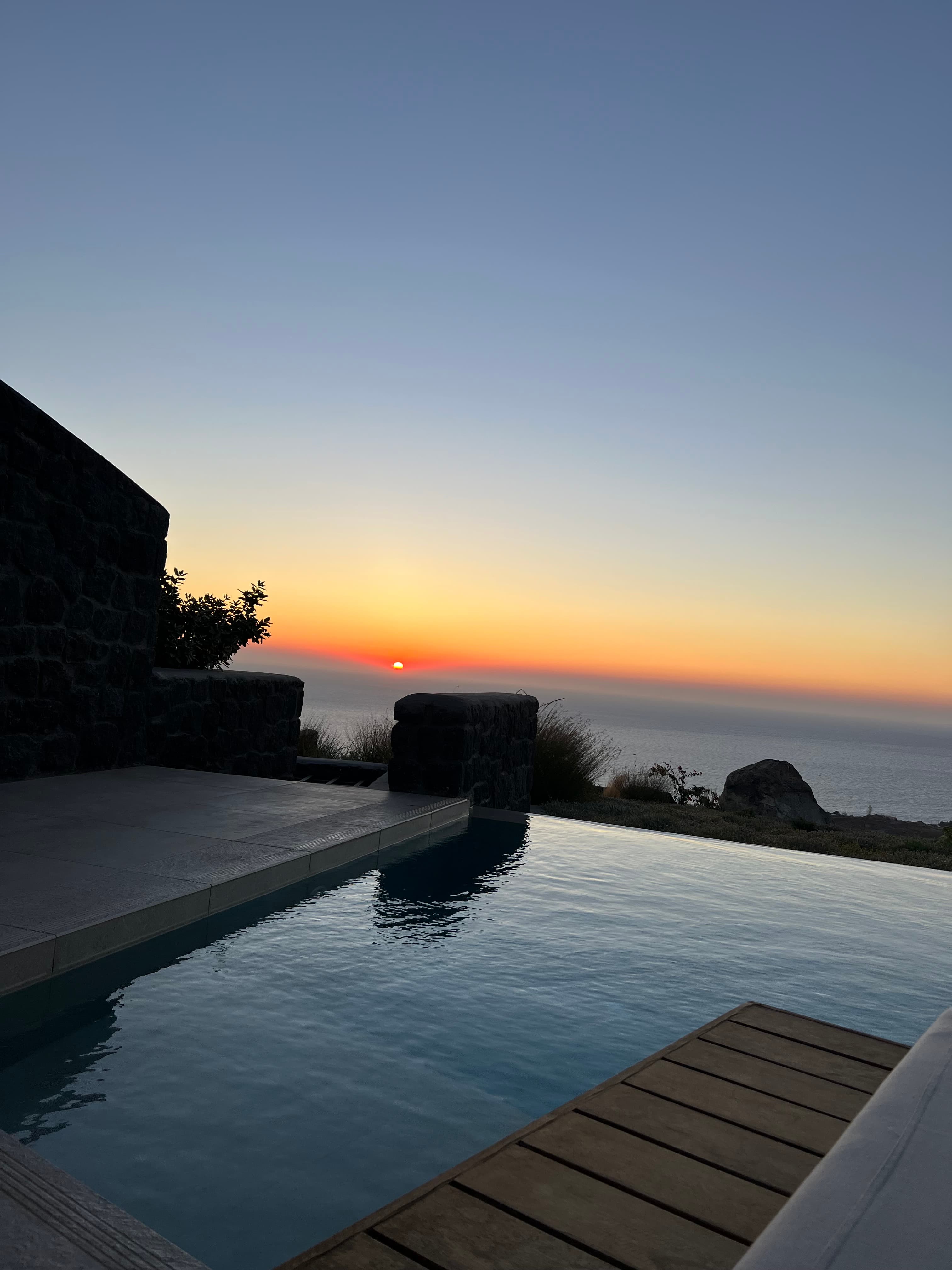 Sunset by an infinity pool.